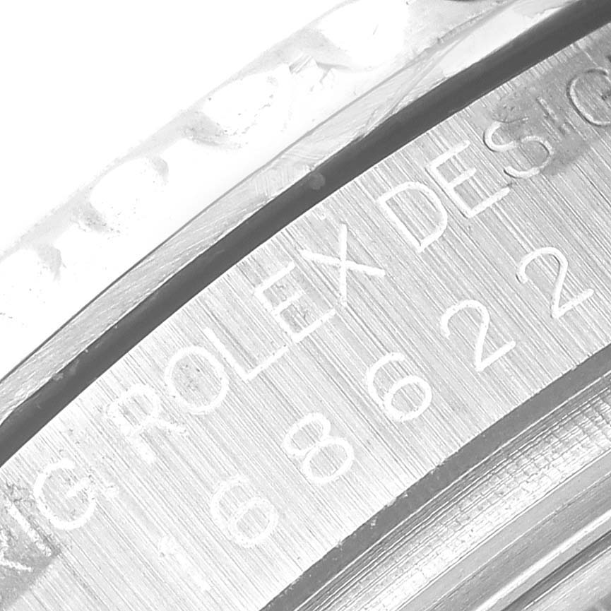 The image shows a close-up angle of the engraved text on the case back of a Rolex Yacht-Master 168622 Men's Stainless Steel Silver Dial 168622 Men's Stainless Steel Silver Dial watch.