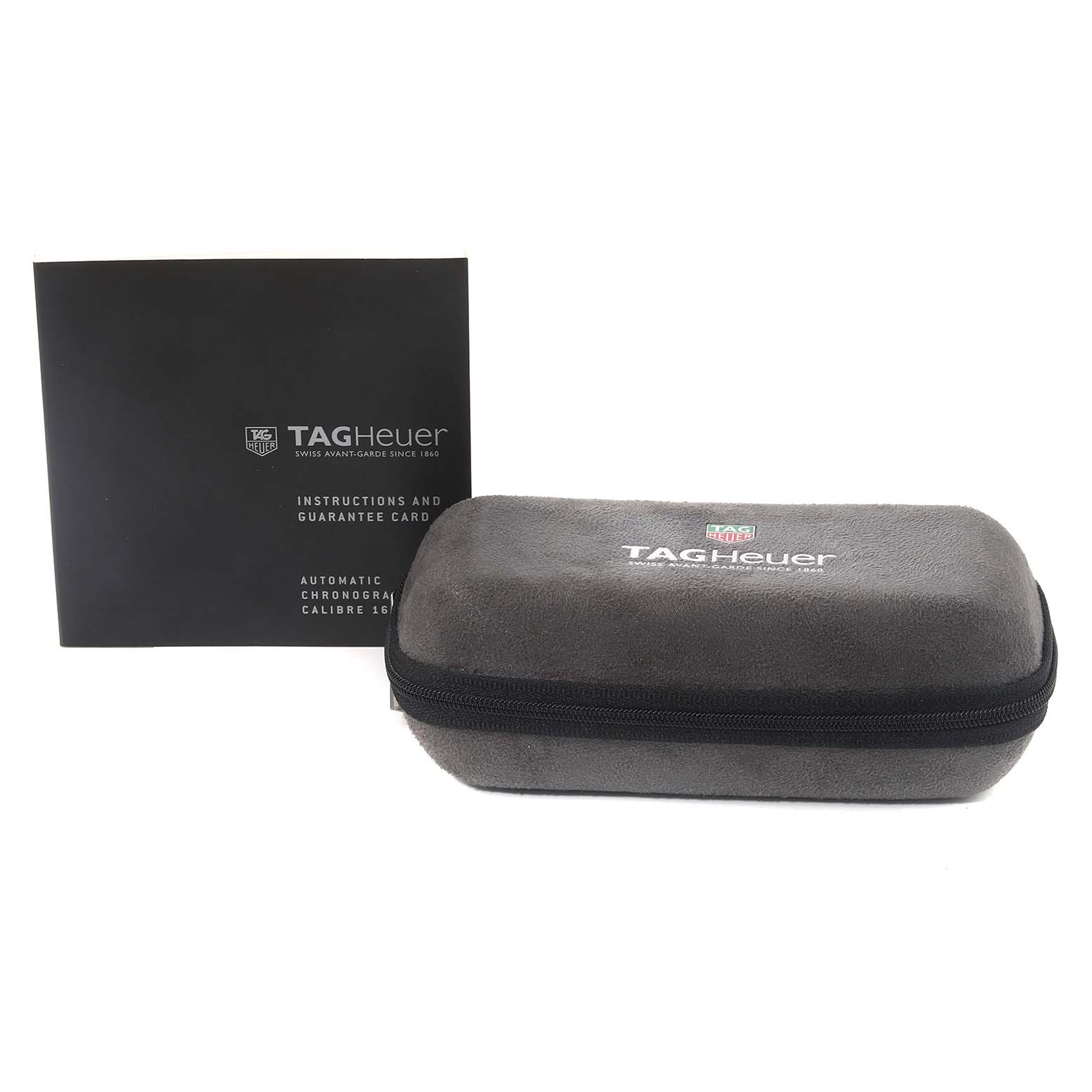 The image shows a Tag Heuer Link CAT2050 Men's Steel and Gold (two tone) Silver Dial CAT2050 Men's Steel and Gold (two tone) Silver Dial model watch case and instruction booklet, viewed from the front.