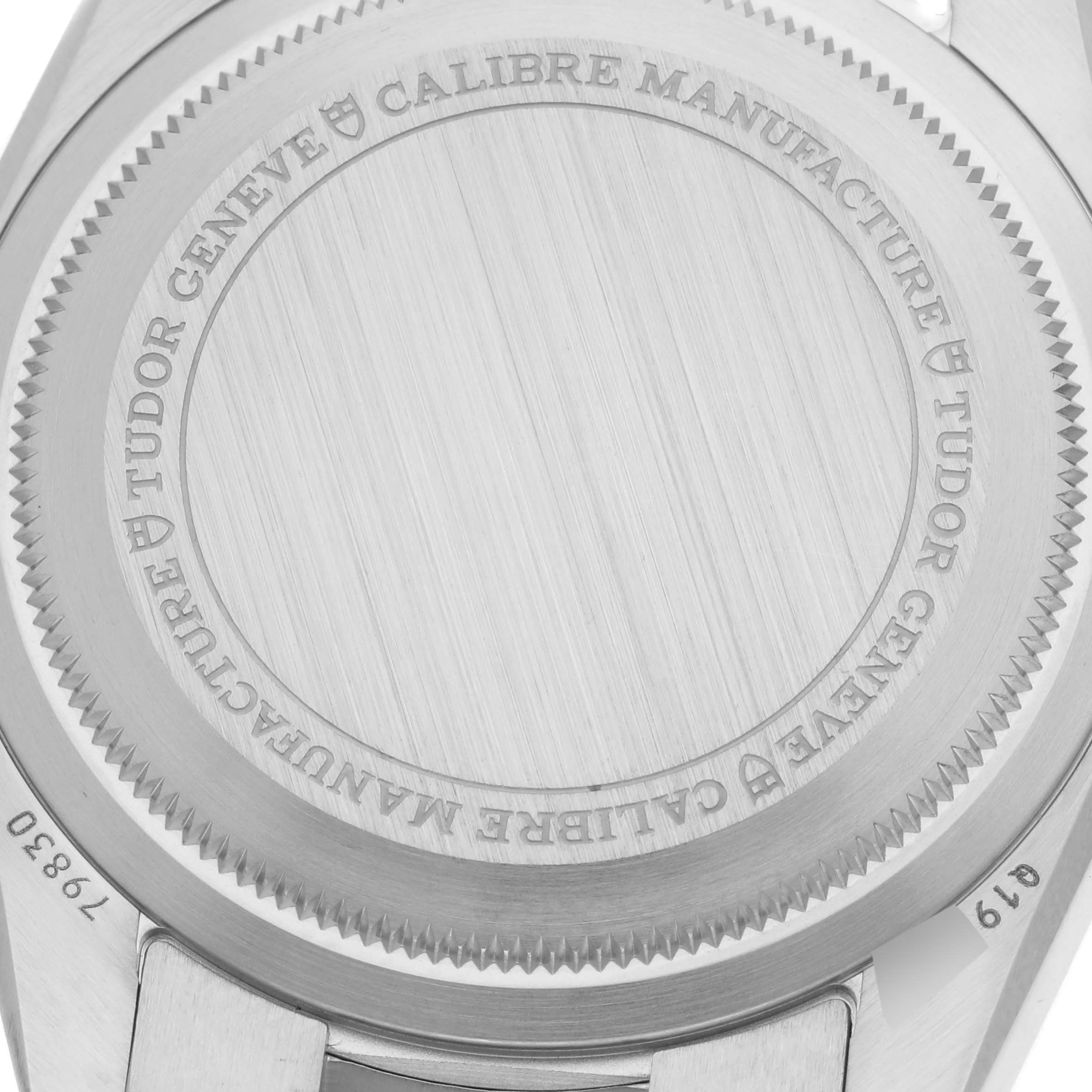 The image shows the back case of the Tudor Heritage Black Bay 79830RB Men's Stainless Steel Black Dial 79830RB Men's Stainless Steel Black Dial watch, focusing on the engraved details.