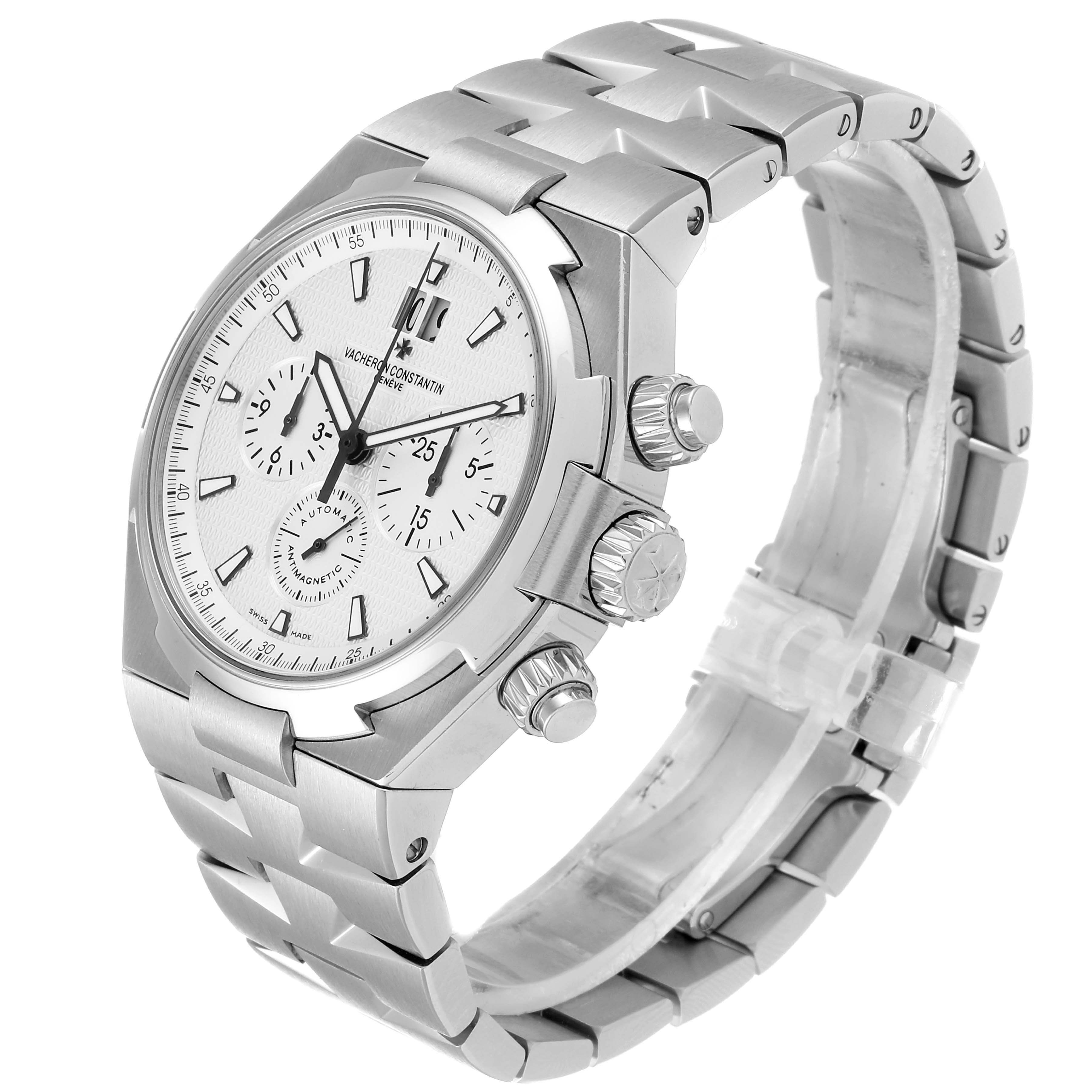 The image shows a side-angle view of a Vacheron Constantin Overseas 49150 Men's Stainless Steel Silver Dial 49150 Men's Stainless Steel Silver Dial watch, highlighting the dial, crown, and metal bracelet.