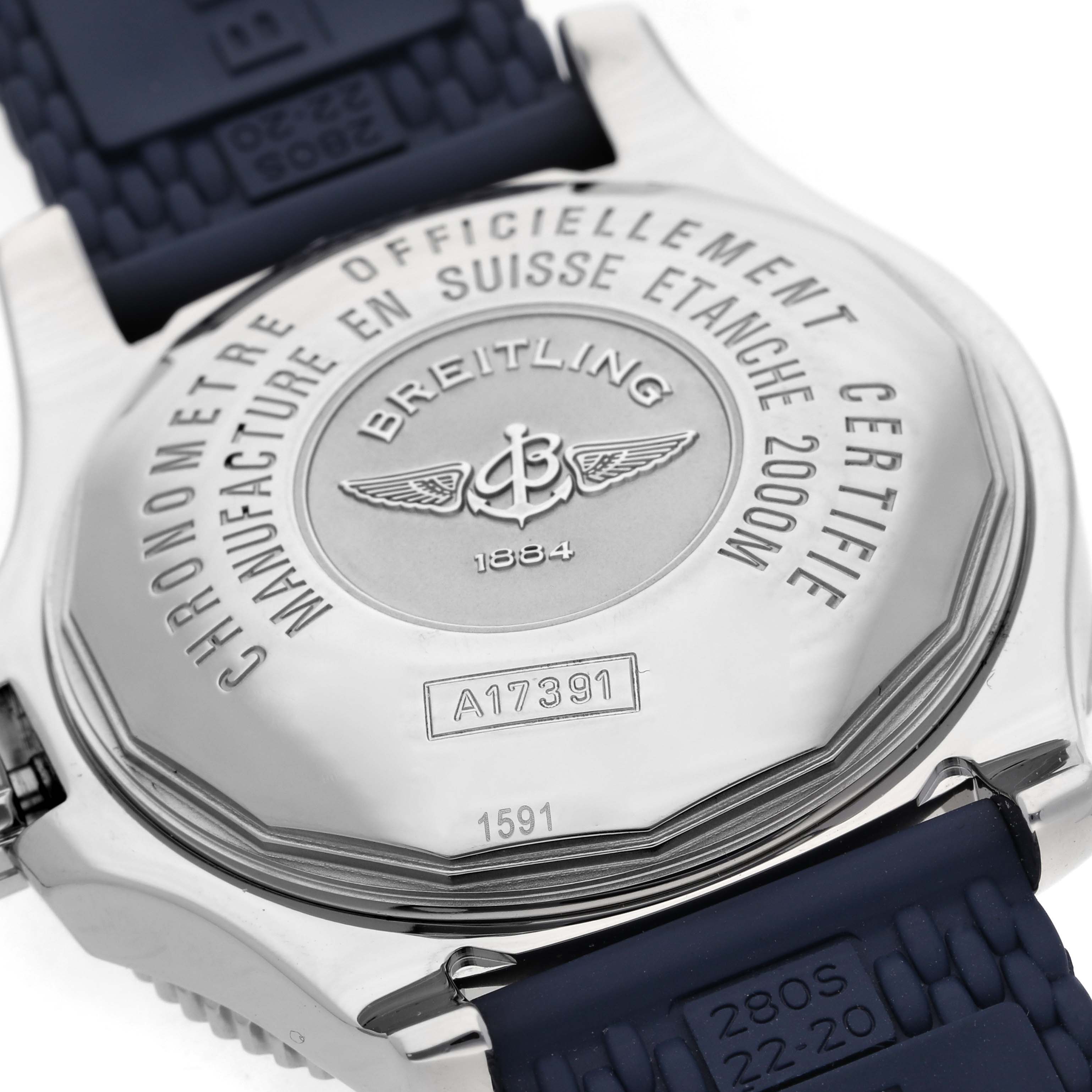 The image shows the back of a Breitling Superocean A17391 Men's Stainless Steel Black Dial A17391 Men's Stainless Steel Black Dial watch, highlighting its engraved details and part of the strap.