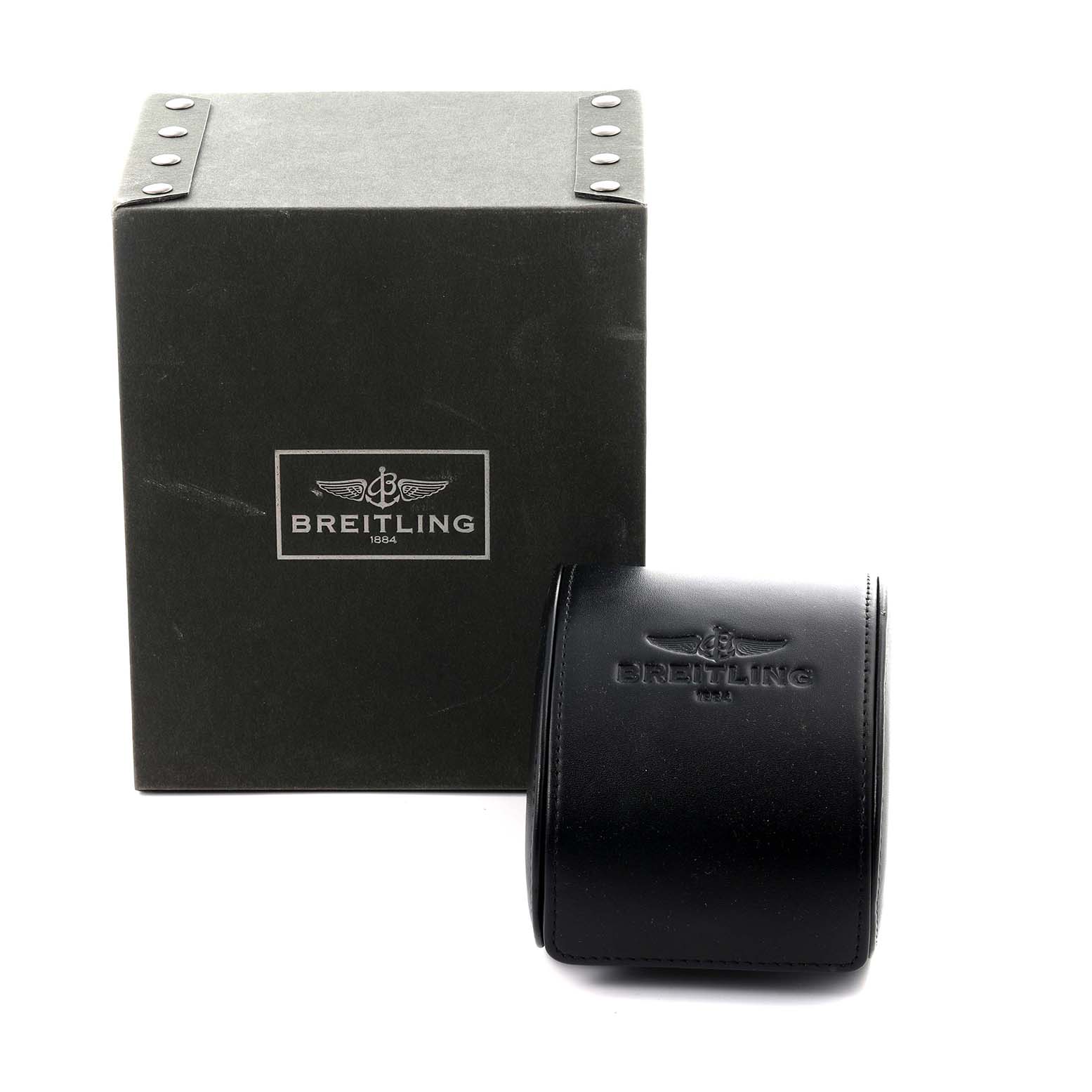 The image shows the packaging for a Breitling Superocean A17391 Men's Stainless Steel Black Dial A17391 Men's Stainless Steel Black Dial watch, featuring a black box and a leather pouch from a front angle.