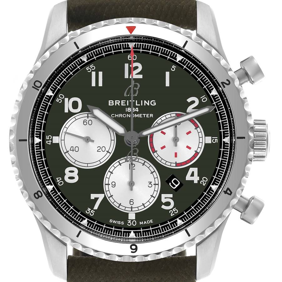 The image shows a frontal view of the Breitling Aviator watch, featuring its green dial, chronograph subdials, and bezel.