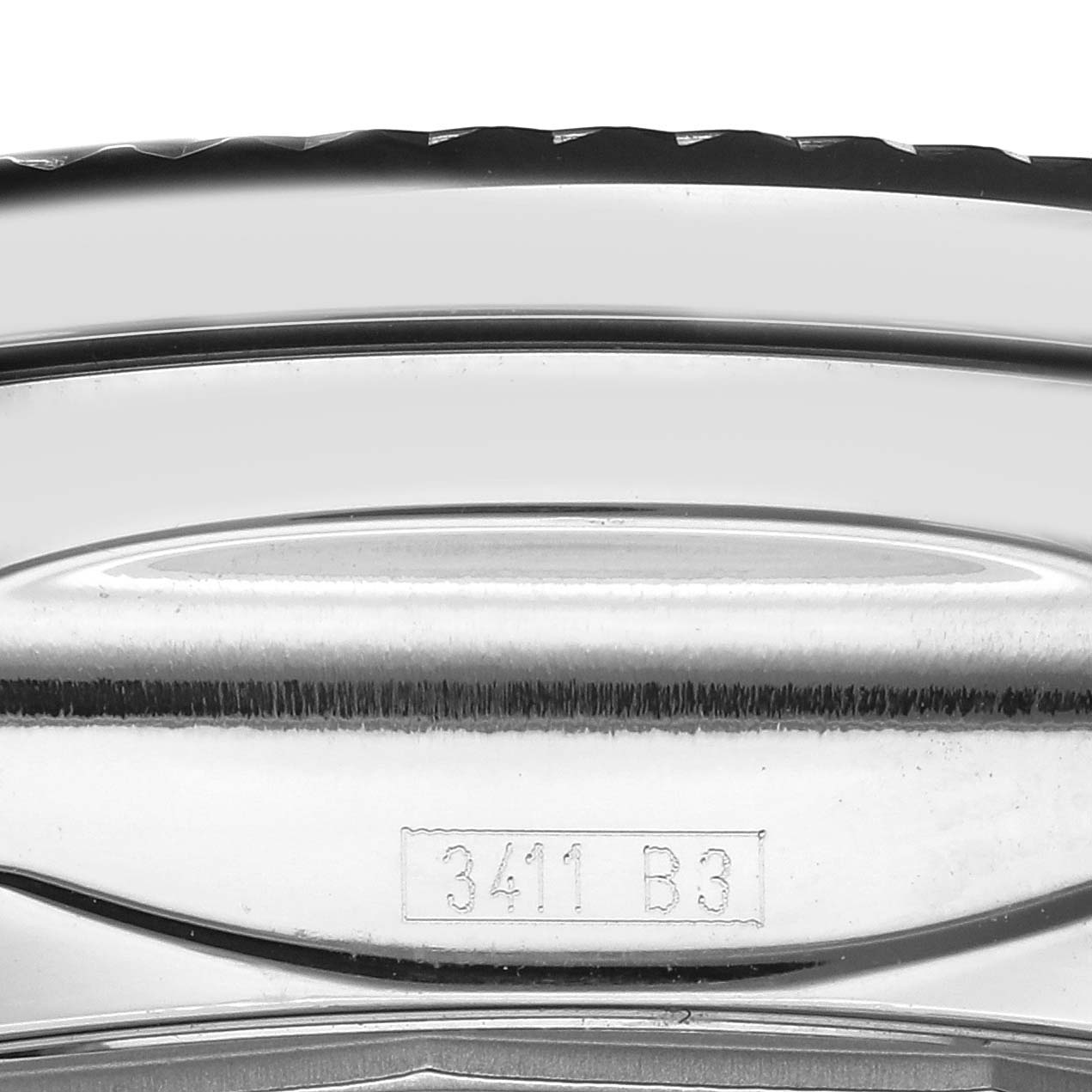 The image shows a close-up of the side of a Bentley model by Breitling, highlighting the bezel and engraved details.