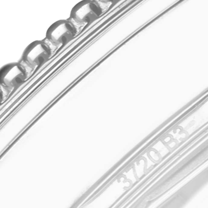 The image shows a close-up of the bezel and part of the casing of the Breitling A17395 Women's Stainless Steel Silver Dial A17395 Women's Stainless Steel Silver Dial Navitimer Automatic 35 model A17395 watch.