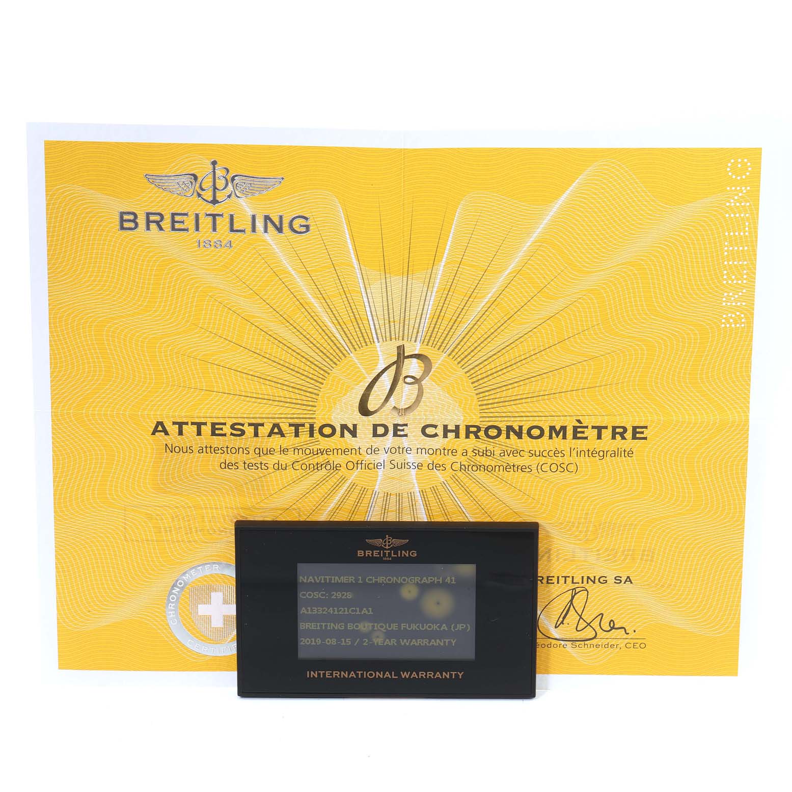 The image shows a Breitling Navitimer A13324 Men
s Stainless Steel Blue Dial A13324 Men
s Stainless Steel Blue Dial model chronometer certificate and international warranty card, positioned front-facing.