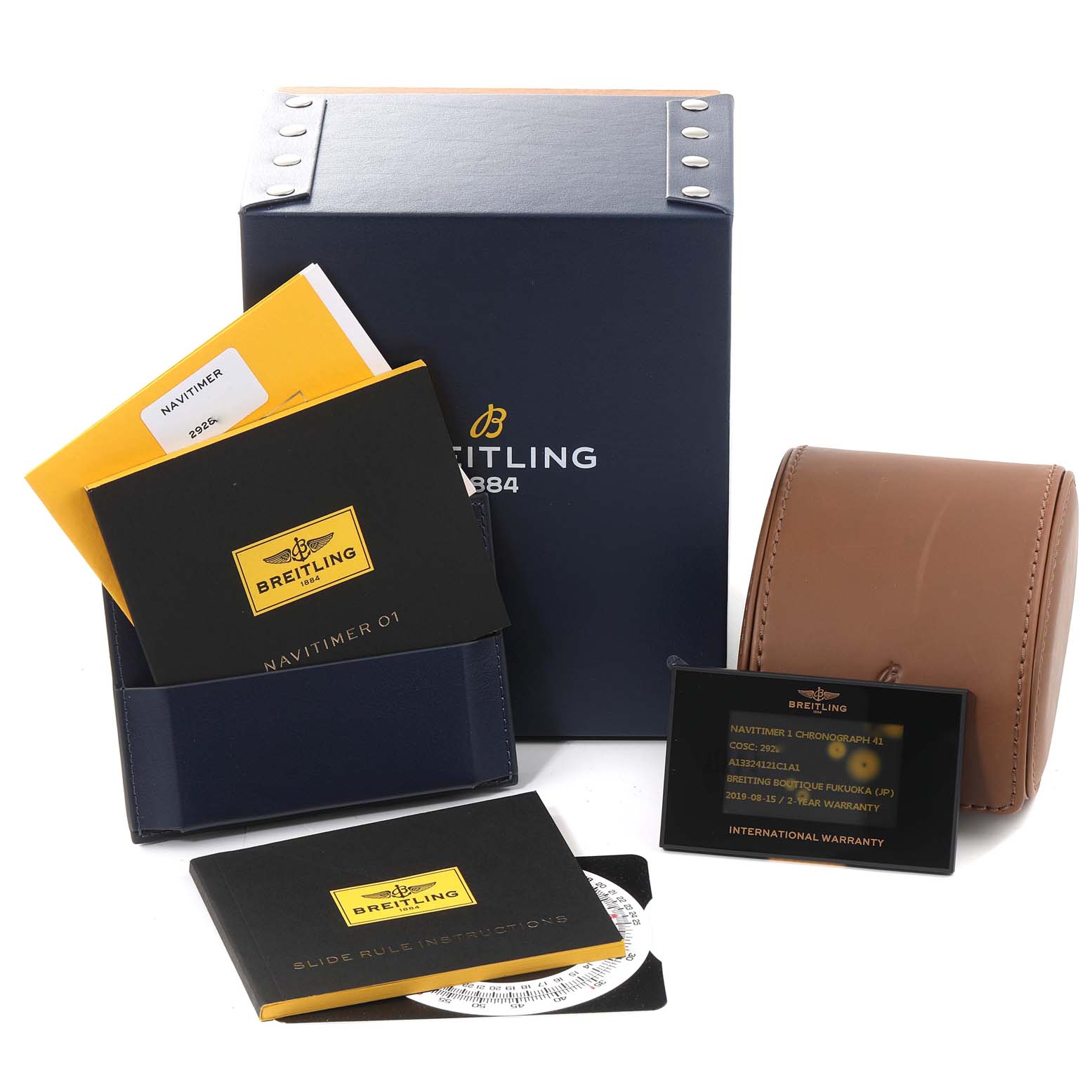 The image shows a Breitling Navitimer A13324 Men
s Stainless Steel Blue Dial A13324 Men
s Stainless Steel Blue Dial watch set with a box, instruction booklets, warranty card, and leather carrying case.