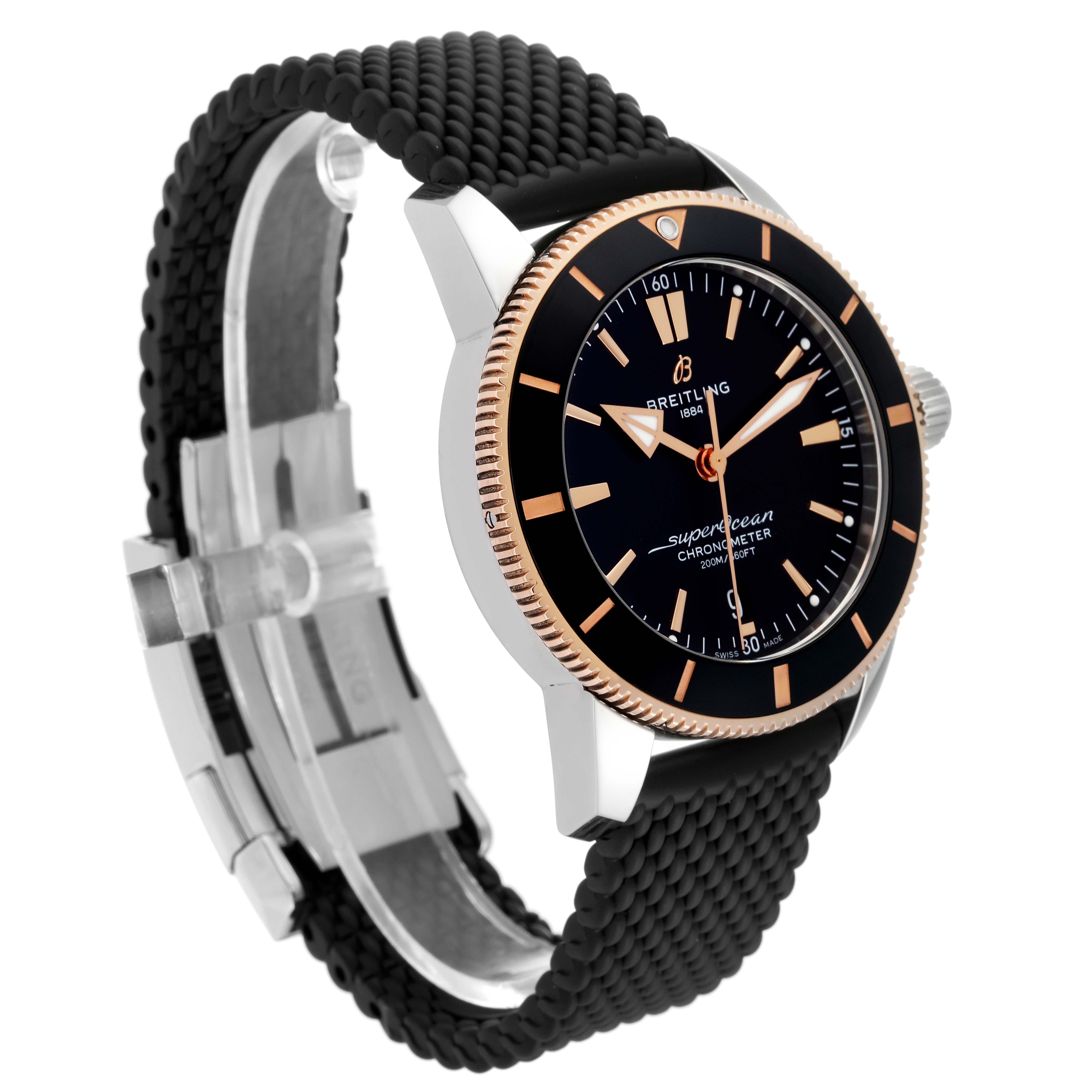 The Breitling Superocean UB2030121B1S1 Men's Steel and Gold (two tone) Black Dial UB2030121B1S1 Men's Steel and Gold (two tone) Black Dial watch is shown from a front-right angle, displaying its black dial, gold bezel, and black textured strap.
