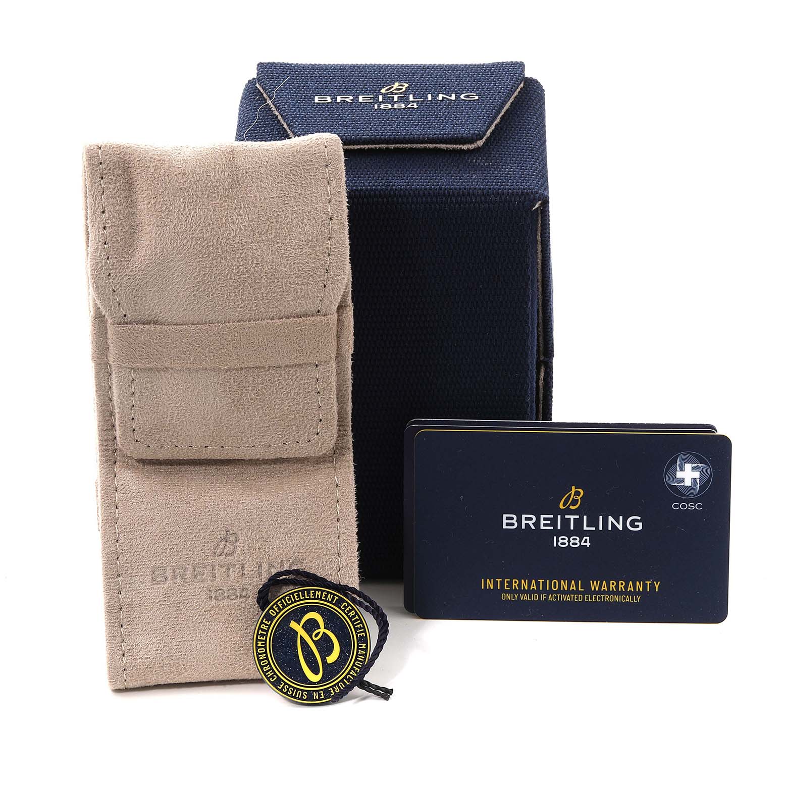 The image shows packaging and accessories for the Breitling Superocean UB2030121B1S1 Men's Steel and Gold (two tone) Black Dial UB2030121B1S1 Men's Steel and Gold (two tone) Black Dial model, including a suede pouch, box, warranty card, and tag.