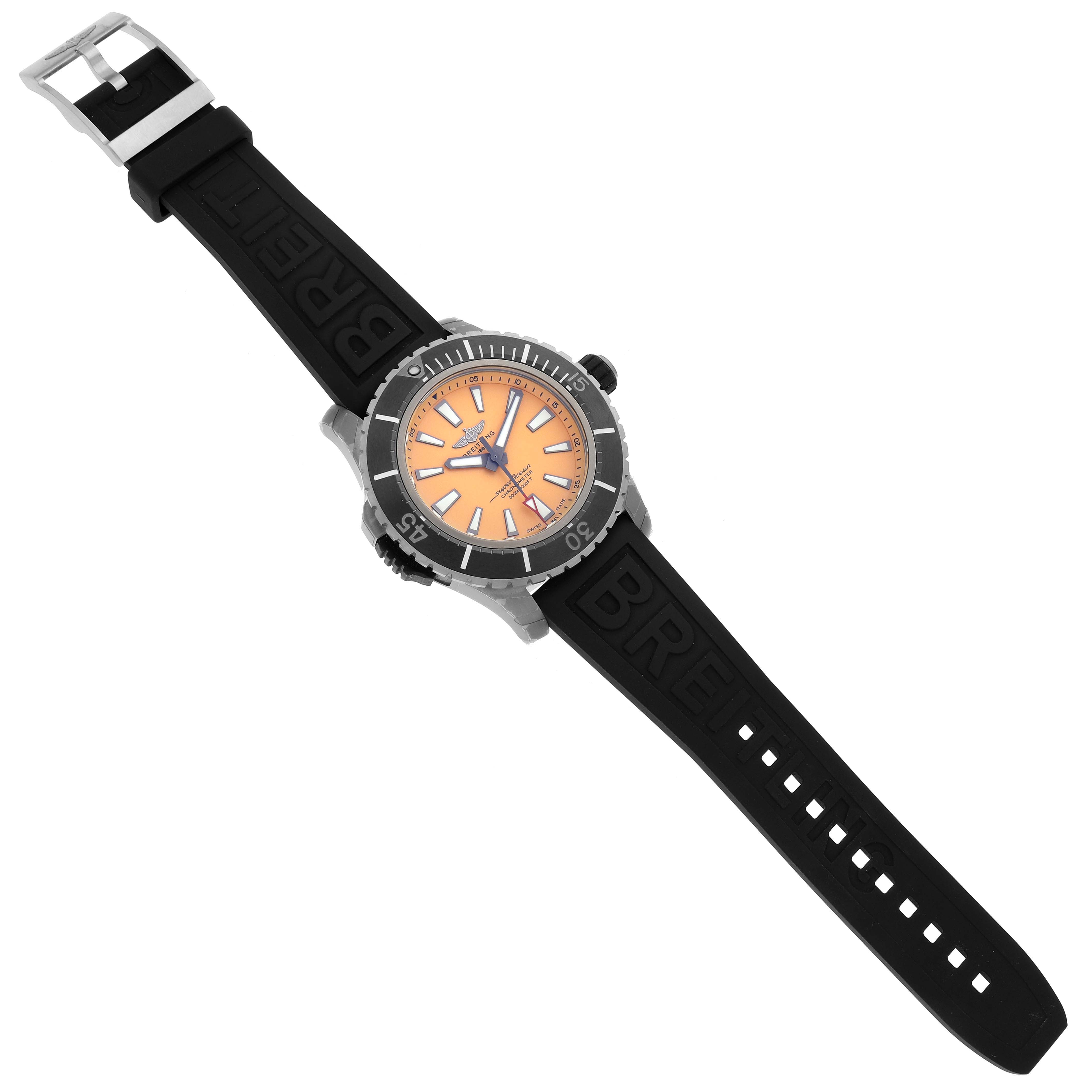 The image shows a top view of the Breitling Superocean E17369241I1S1 Men
s Titanium Yellow Dial E17369241I1S1 Men
s Titanium Yellow Dial watch featuring an orange dial and black rubber strap.