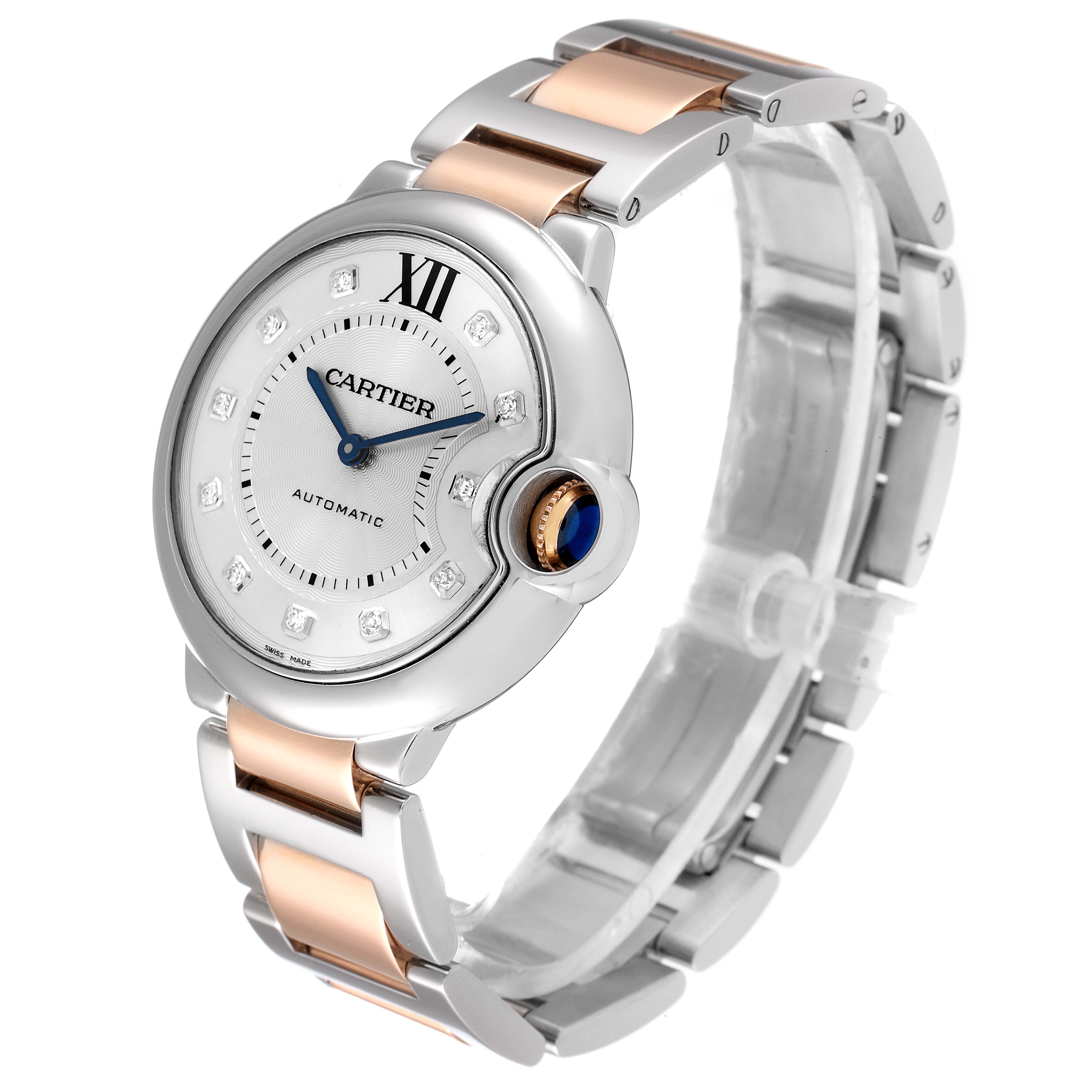 This image shows a side angle view of the Cartier Ballon Bleu WE902031 Women
s Steel and Gold (two tone) Silver Dial WE902031 Women
s Steel and Gold (two tone) Silver Dial watch, highlighting the face, crown, and two-tone bracelet.