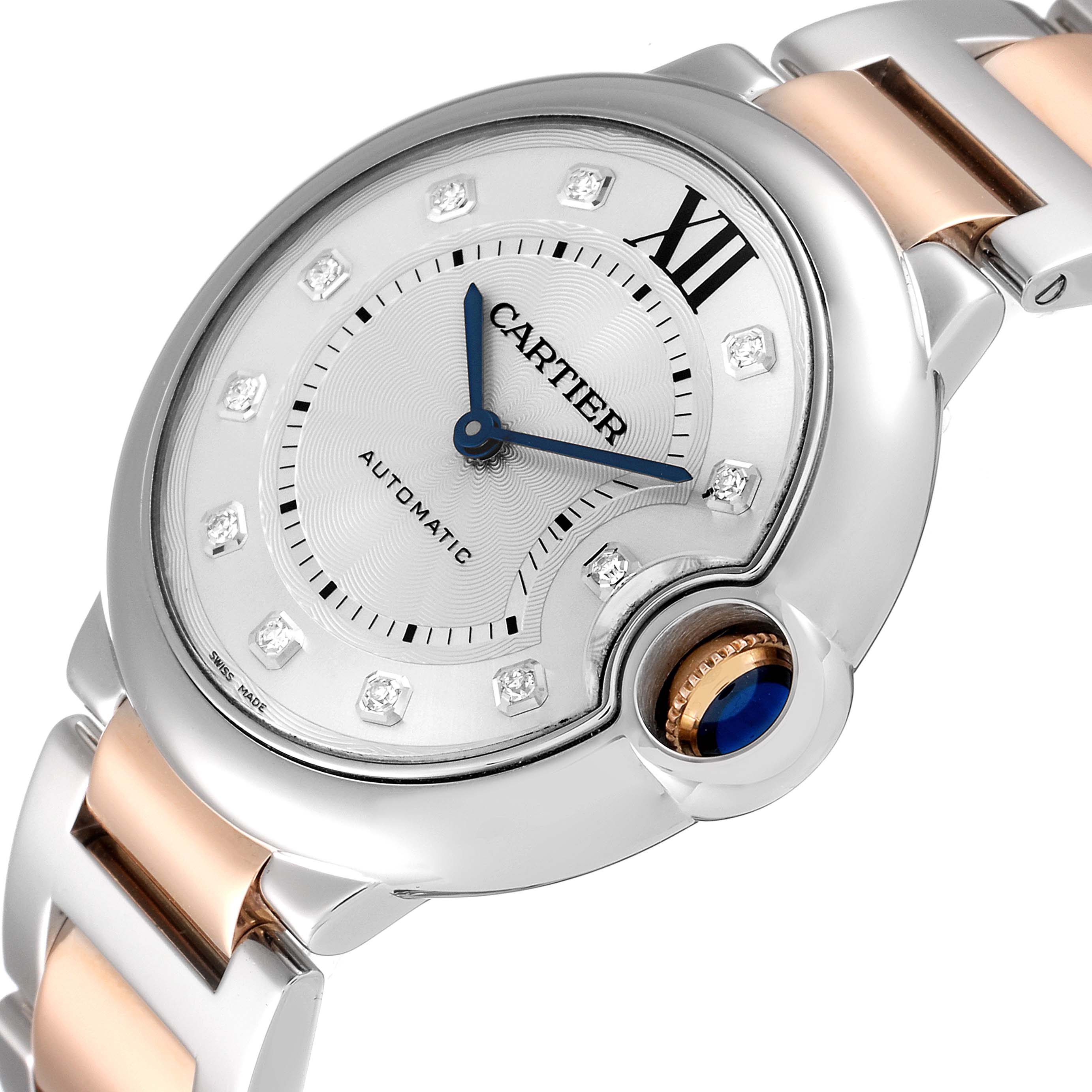 This image shows a close-up angled view of the dial, crown, and part of the strap of the Cartier Ballon Bleu WE902031 Women
s Steel and Gold (two tone) Silver Dial WE902031 Women
s Steel and Gold (two tone) Silver Dial watch.
