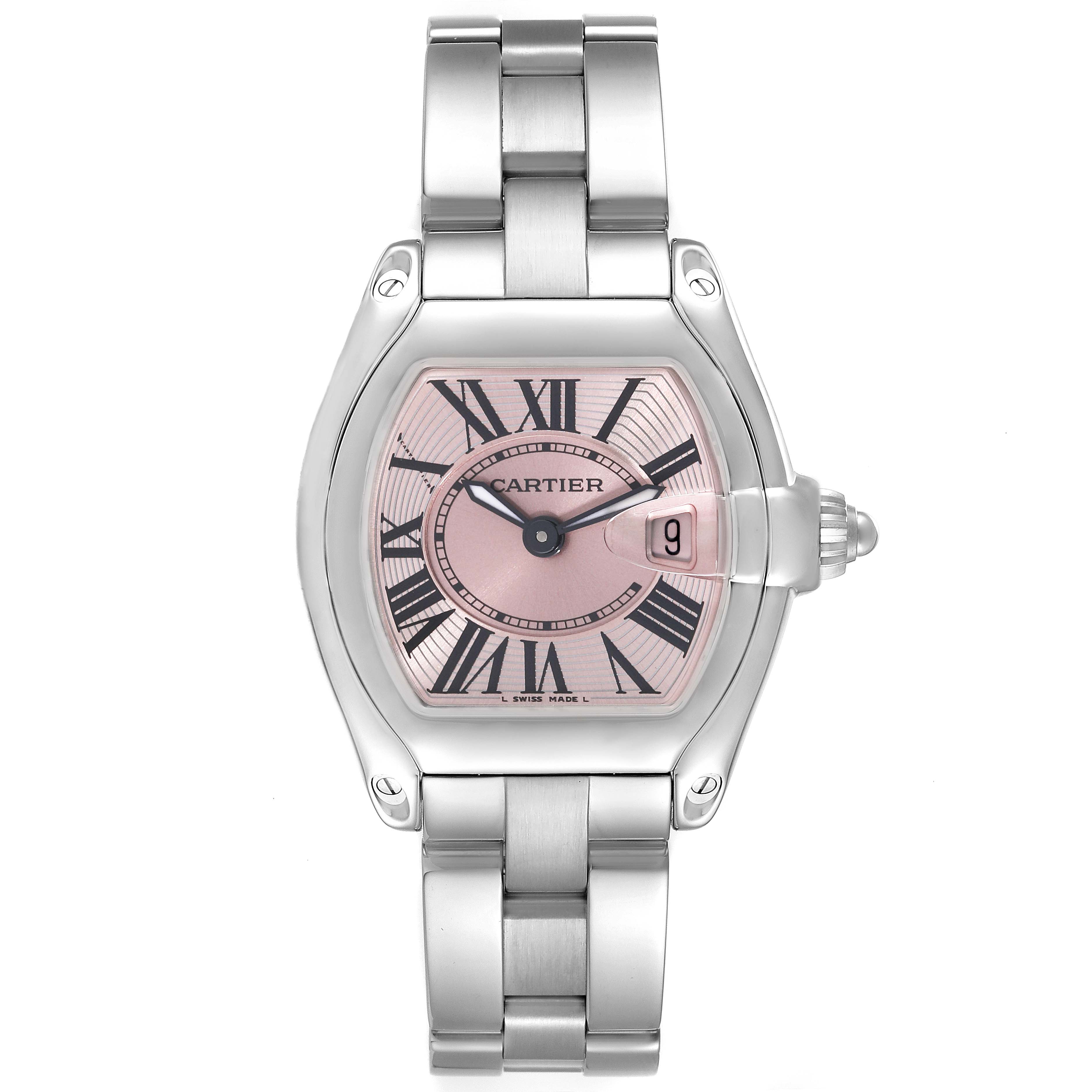 The image shows a frontal view of a Cartier Roadster W62017V3 Women's Stainless Steel Pink Dial W62017V3 Women's Stainless Steel Pink Dial watch, highlighting its pink dial, Roman numerals, and metal bracelet.