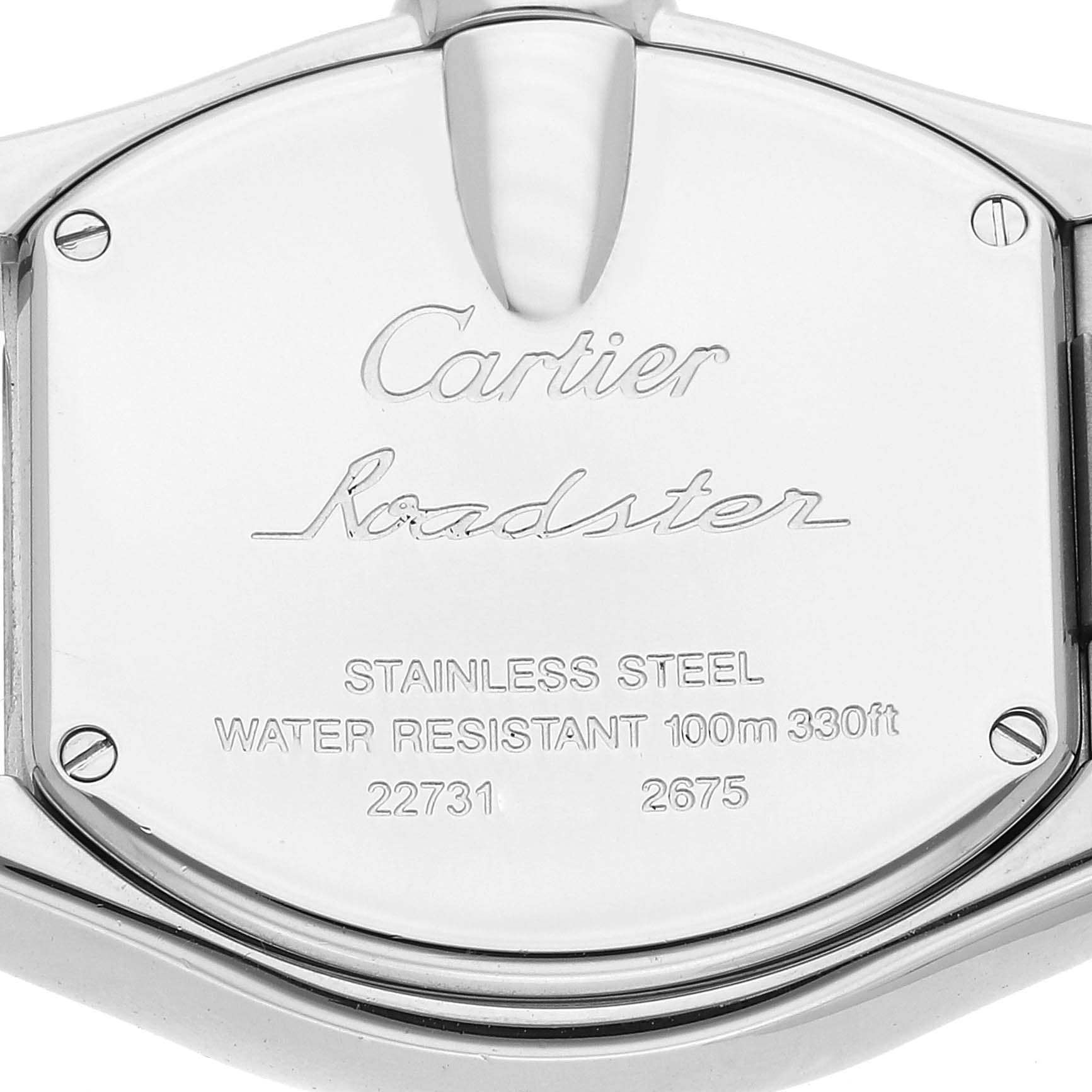 The image shows the back case of a Cartier Roadster W62017V3 Women's Stainless Steel Pink Dial W62017V3 Women's Stainless Steel Pink Dial watch, highlighting its engravings and screws.