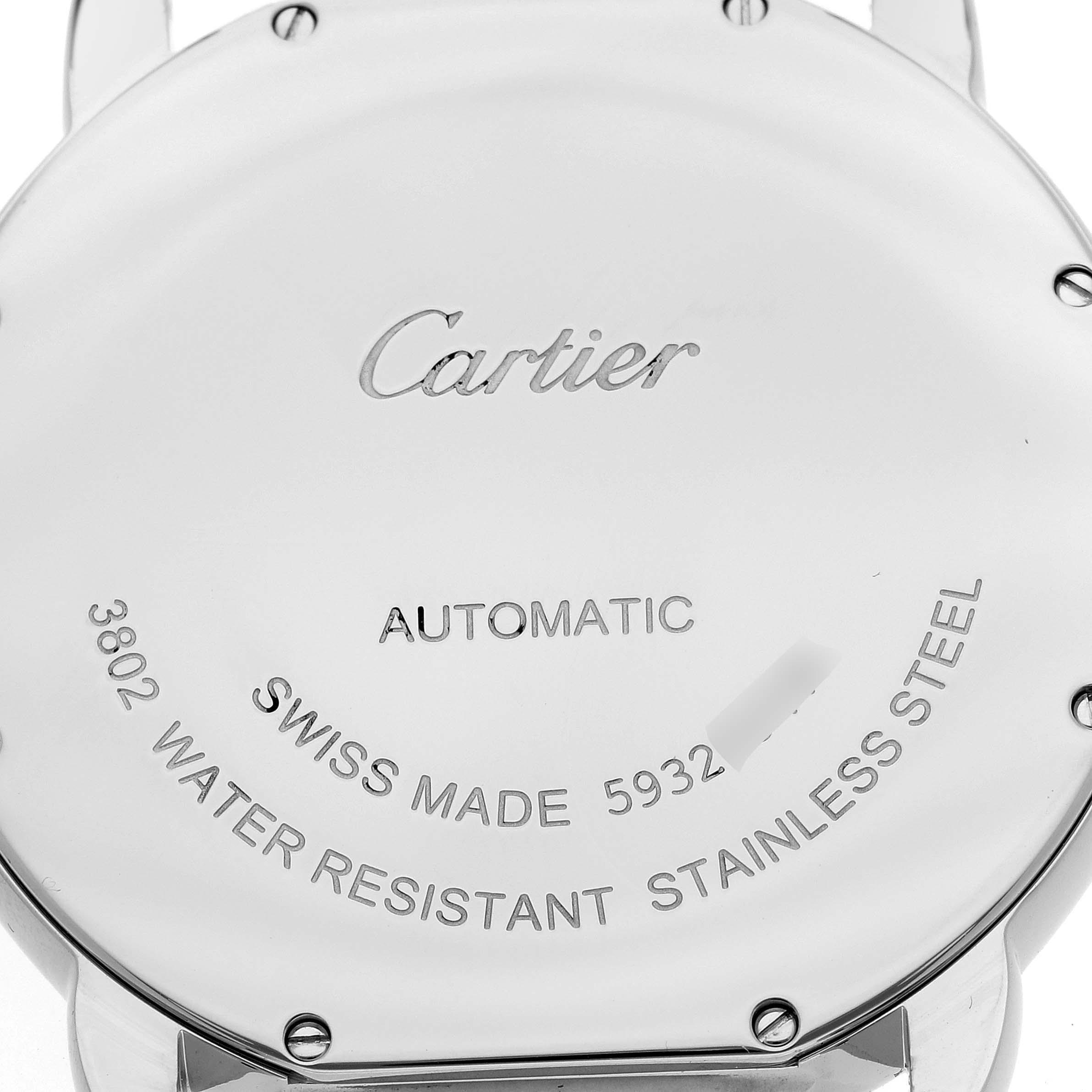 The image shows the back case of a Cartier Ronde W6701010 Men
s Stainless Steel Silver Dial W6701010 Men
s Stainless Steel Silver Dial watch, displaying its inscriptions and screws.