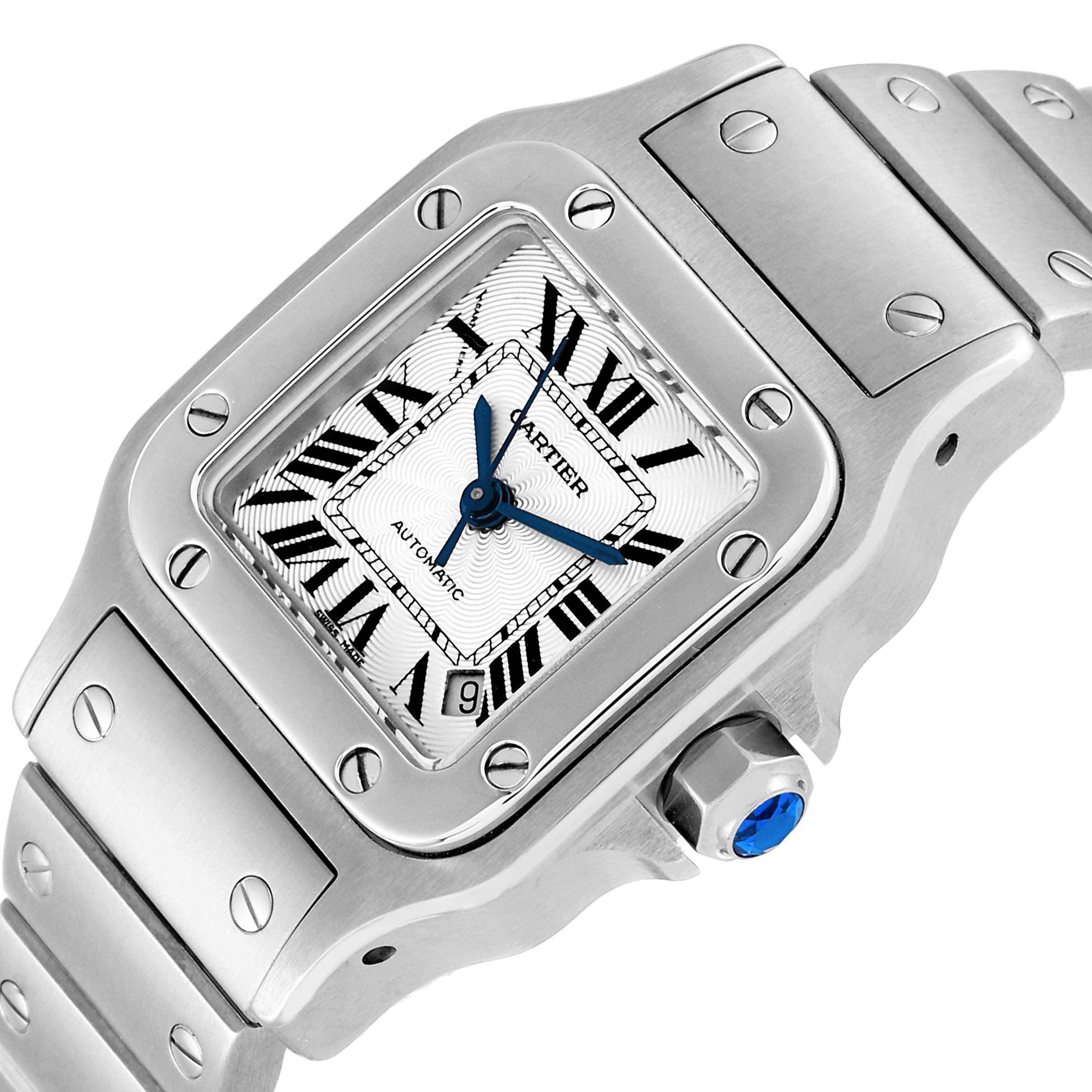 The image shows a close-up angled view of a Cartier Santos W20054D6 Women's Stainless Steel Silver Dial W20054D6 Women's Stainless Steel Silver Dial watch, featuring the dial, bezel, bracelet, and crown with a blue jewel.