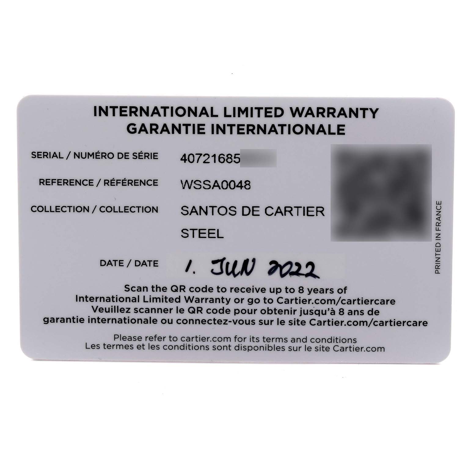 This image shows the international limited warranty card for the Cartier Santos WSSA0048 Men's Stainless Steel Blue Dial WSSA0048 Men's Stainless Steel Blue Dial model, displaying serial and reference numbers.