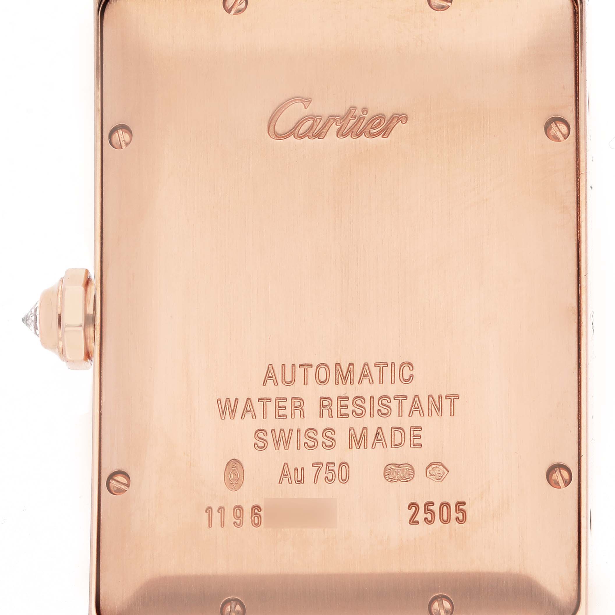 The image shows the back case of a Cartier Tank Americaine WB704851 Men's Rose Gold Silver Dial WB704851 Men's Rose Gold Silver Dial watch, highlighting engravings and the crown with a gemstone.