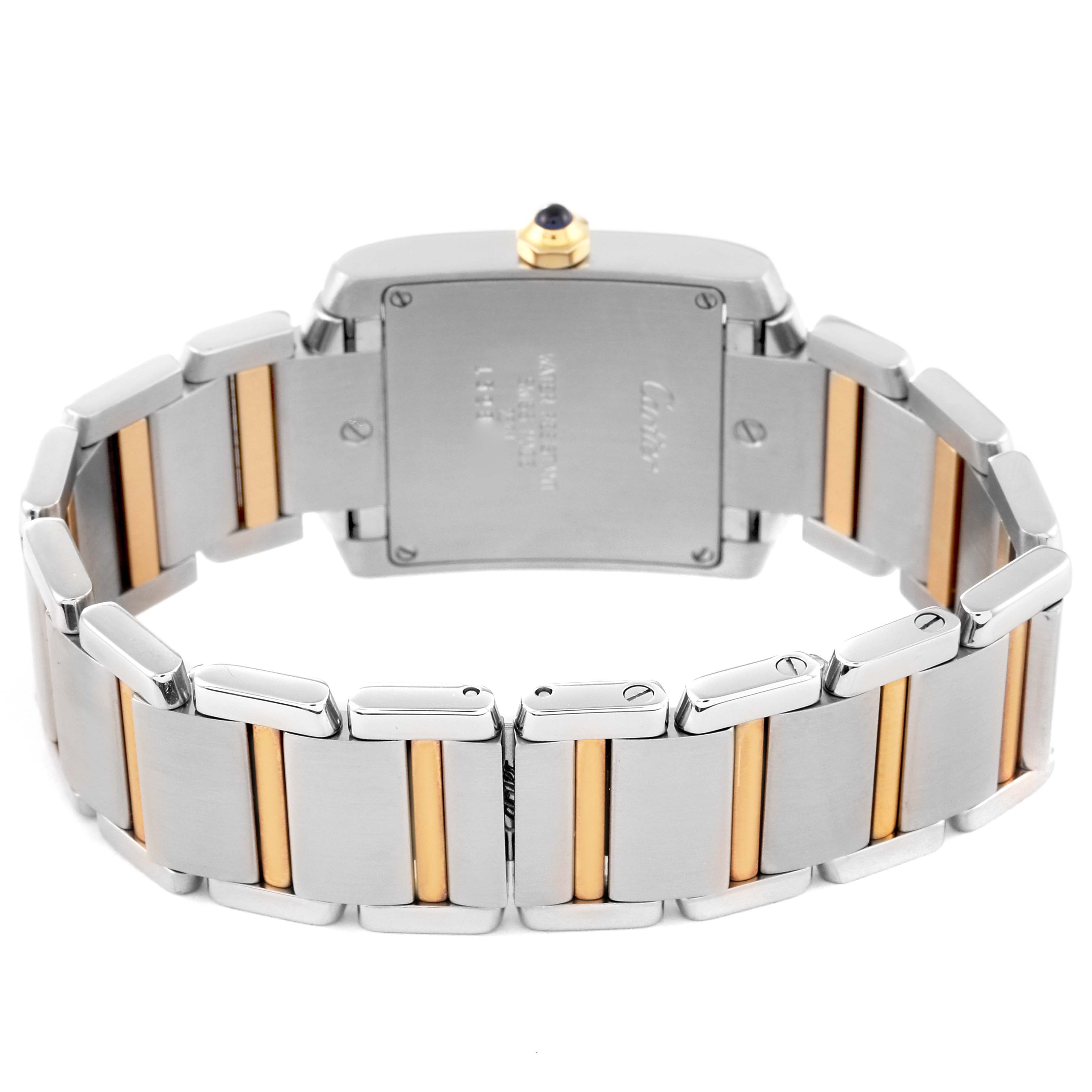 The image shows the back of the Cartier Tank Française watch, highlighting the stainless steel and gold bracelet, and the case back.