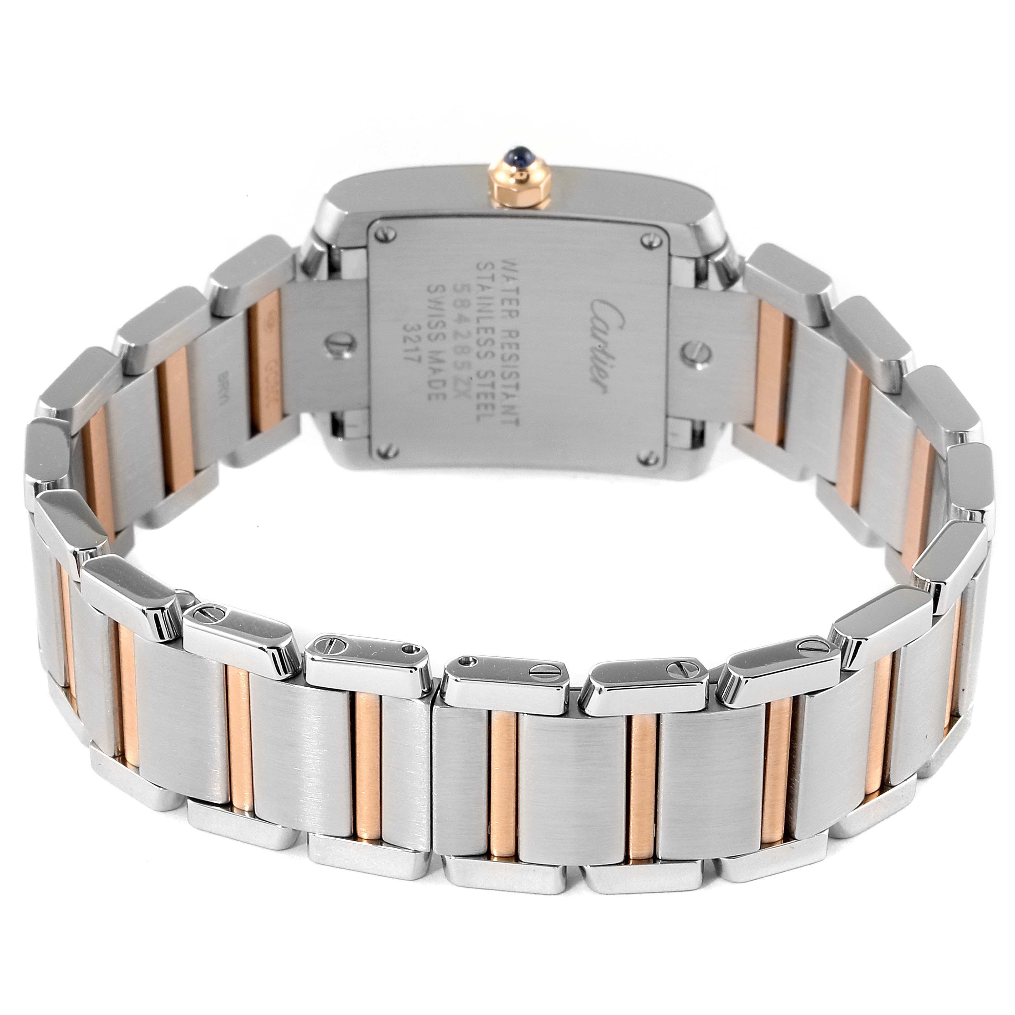 The image shows the back view of the Cartier Tank Française watch, focusing on the case back and stainless steel bracelet with gold accents.