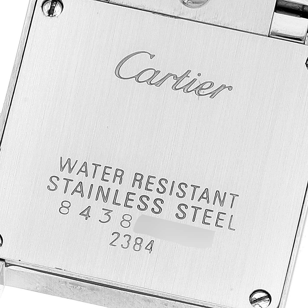 This is a close-up shot of the case back of a Cartier Tank Francaise W51027Q4 Women's Steel and Gold (two tone) Mother of Pearl Dial W51027Q4 Women's Steel and Gold (two tone) Mother of Pearl Dial watch, showing the brand engraving and water resistance information.