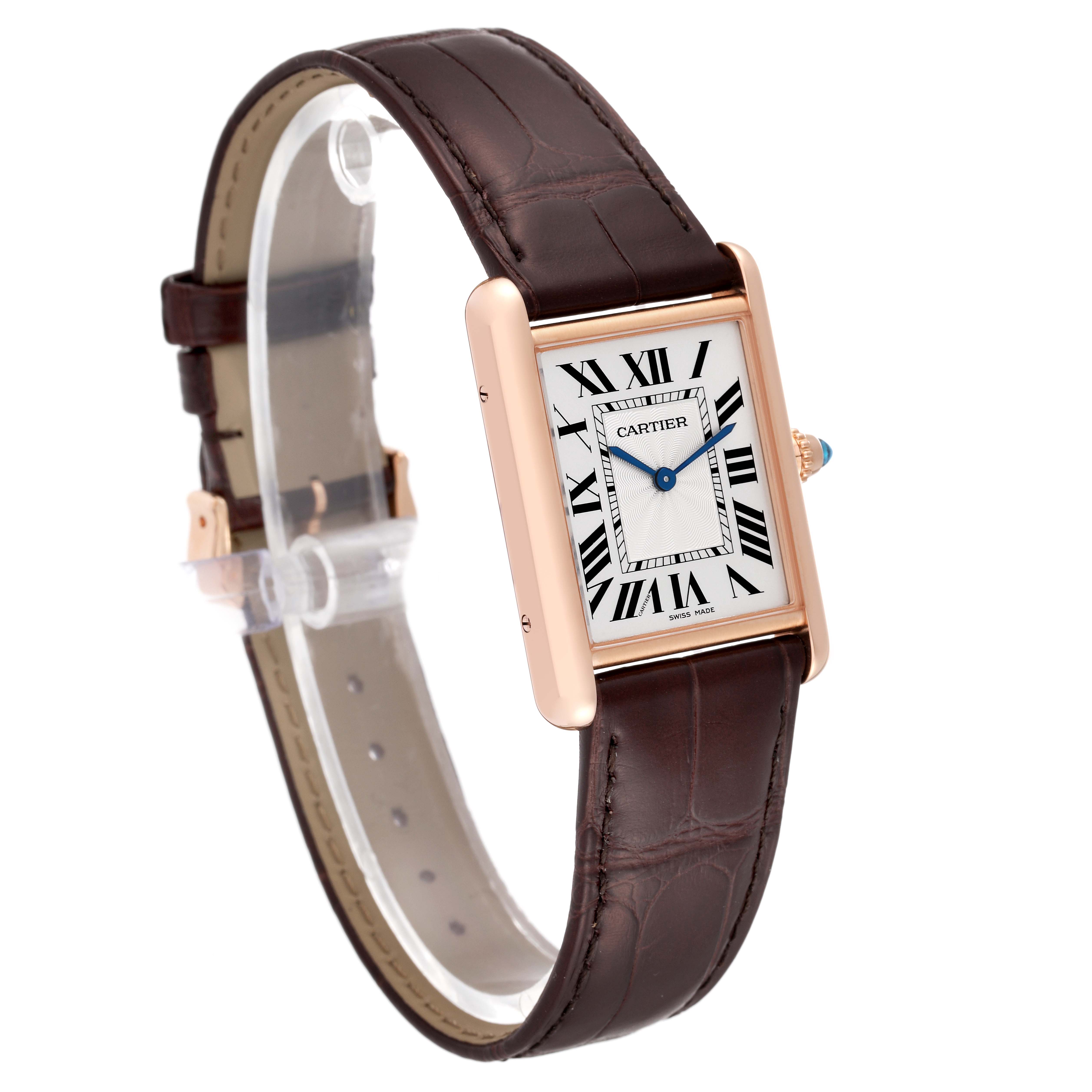 The Cartier Tank Louis WGTA0011 Men
s Rose Gold Silver Dial WGTA0011 Men
s Rose Gold Silver Dial watch is shown at a slight angle, displaying the face, Roman numerals, blue hands, and a brown leather strap.