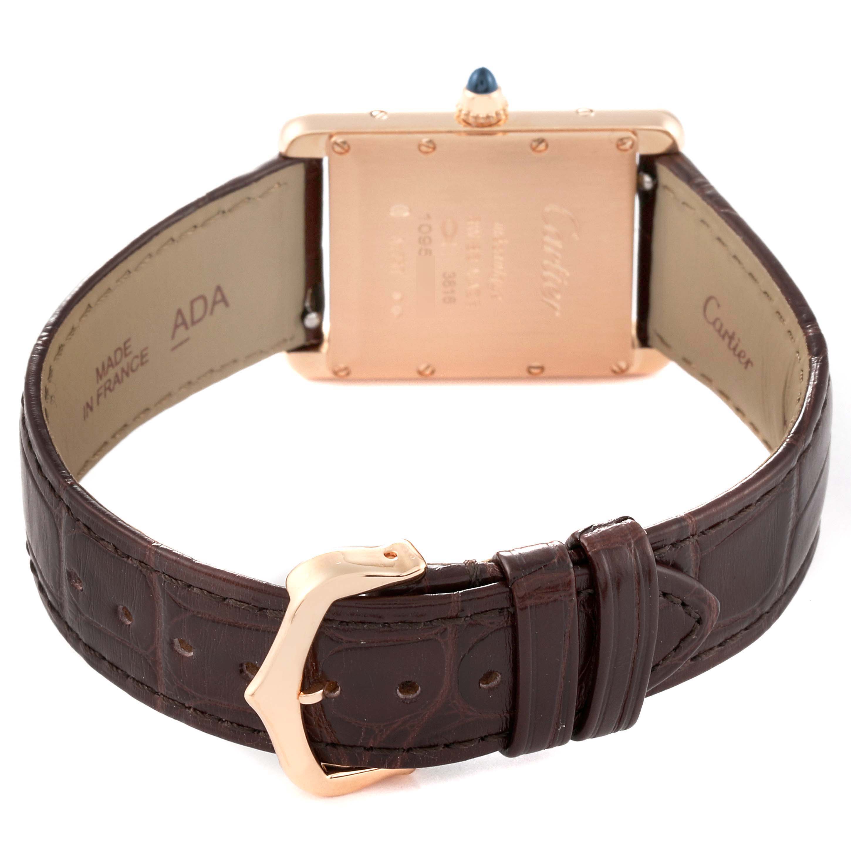 The image shows the back and strap of a Cartier Tank Louis WGTA0011 Men
s Rose Gold Silver Dial WGTA0011 Men
s Rose Gold Silver Dial watch, highlighting the engravings, buckle, and leather band.