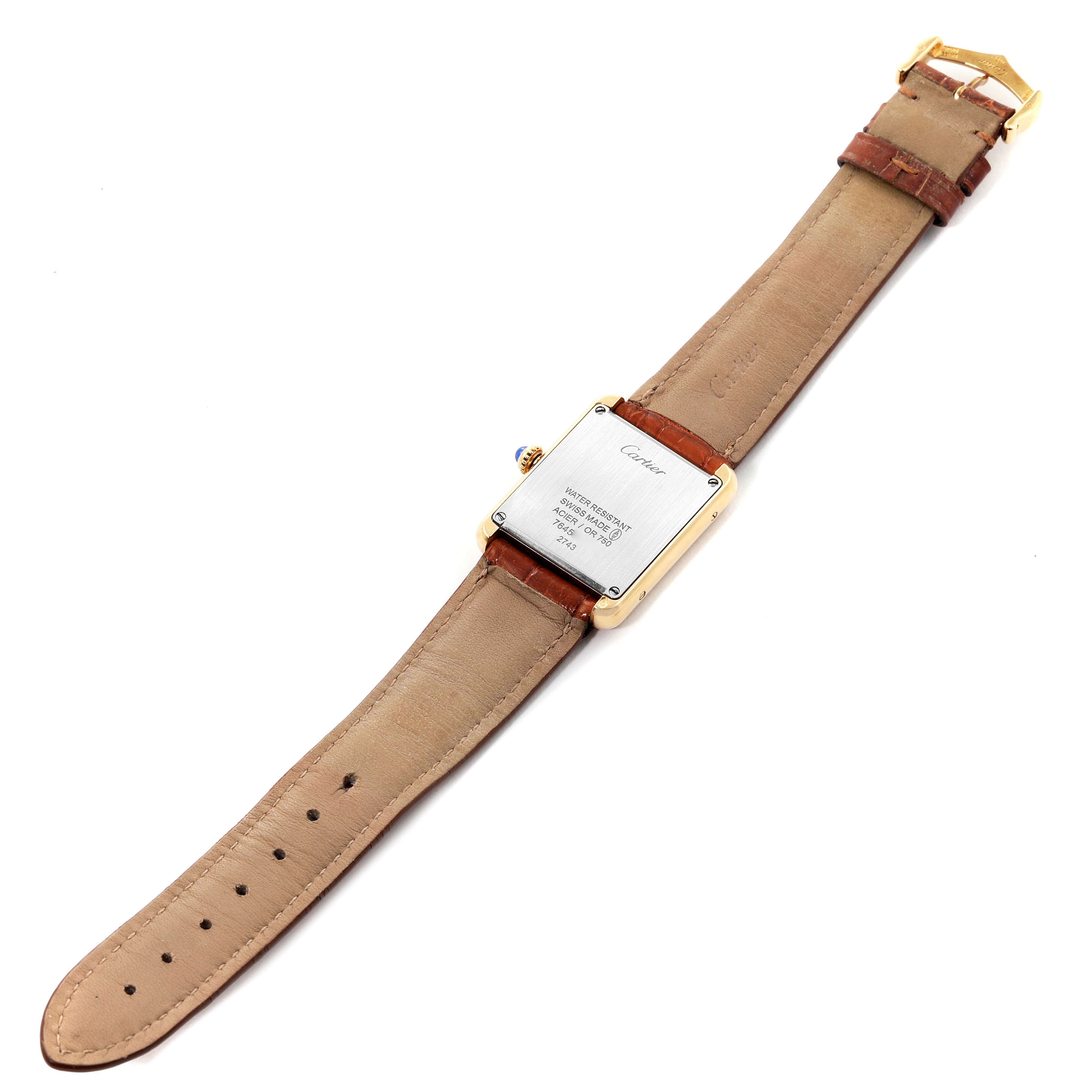 The image shows the backside of the Cartier Tank Solo W1018755 Women's Yellow Gold Silver Dial W1018755 Women's Yellow Gold Silver Dial watch, highlighting the strap and watch case back.