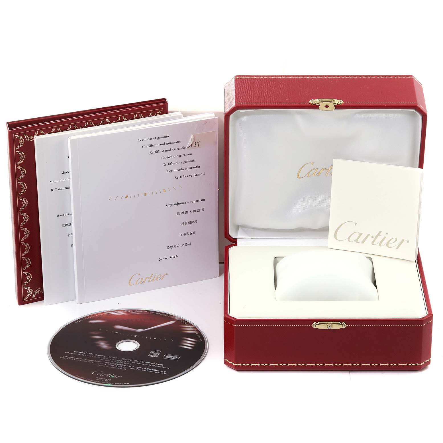The image shows an open Cartier box for a Tank Solo watch model, accompanied by a CD, booklets, and certificates.