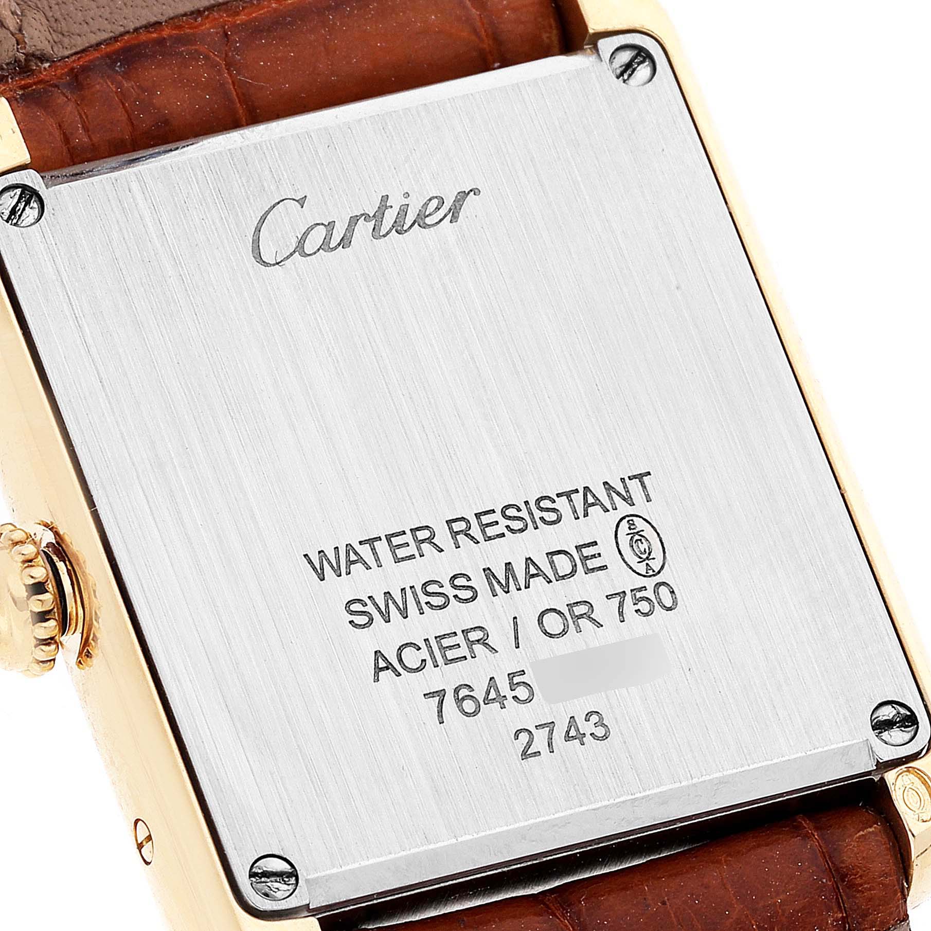 This image shows the back case of the Cartier Tank Solo W1018755 Women's Yellow Gold Silver Dial W1018755 Women's Yellow Gold Silver Dial watch, highlighting the brand engravings and specifications.
