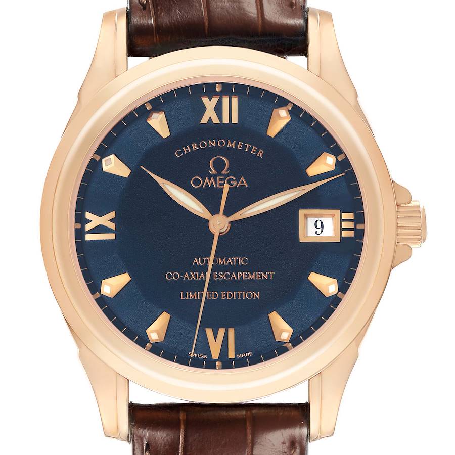 The image shows a frontal view of the Omega De Ville watch, highlighting the dial, case, crown, and part of the strap.
