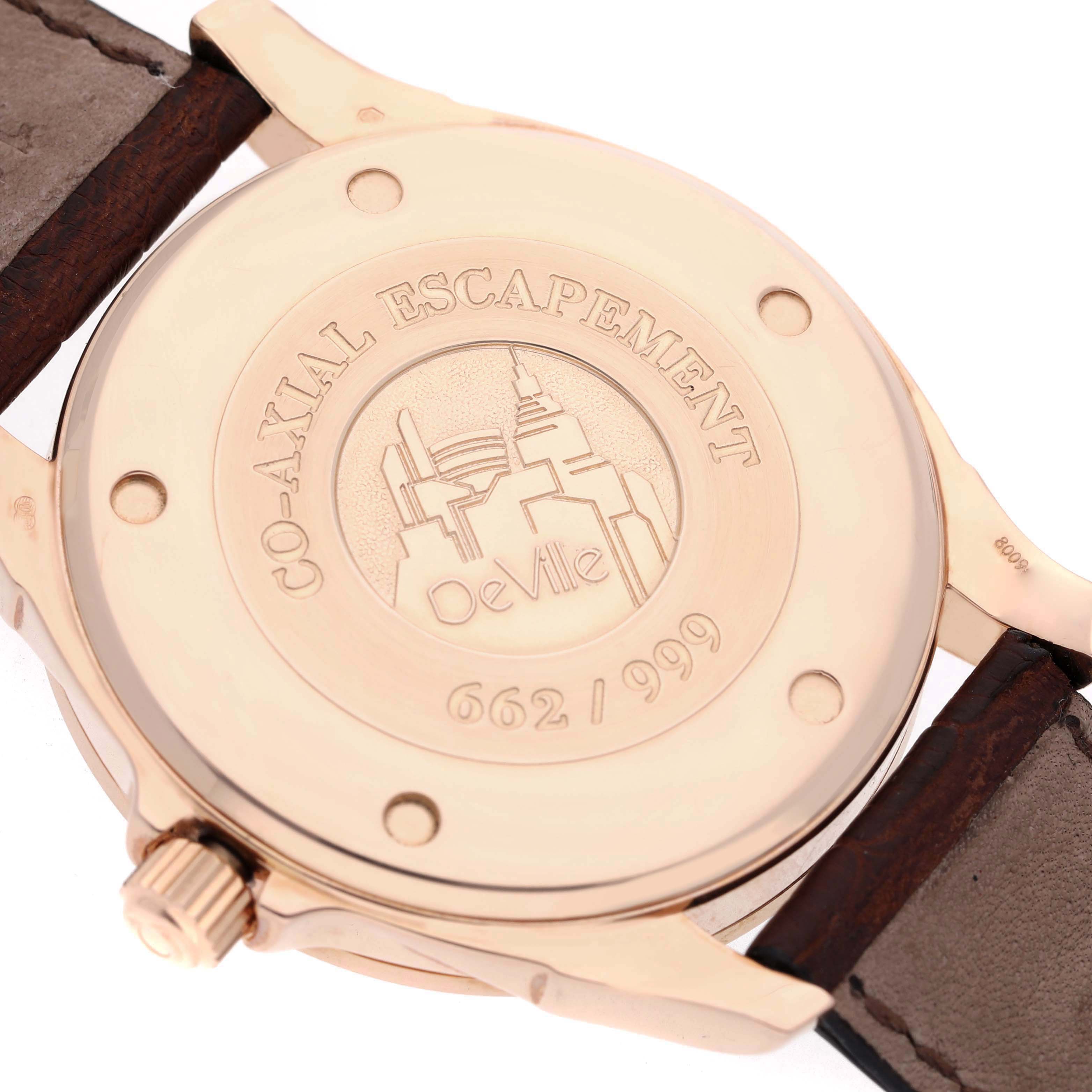 The image shows the back case of the Omega De Ville 5931.81.23 Men
s Rose Gold Blue Dial 5931.81.23 Men
s Rose Gold Blue Dial watch, highlighting its engraving and leather strap.