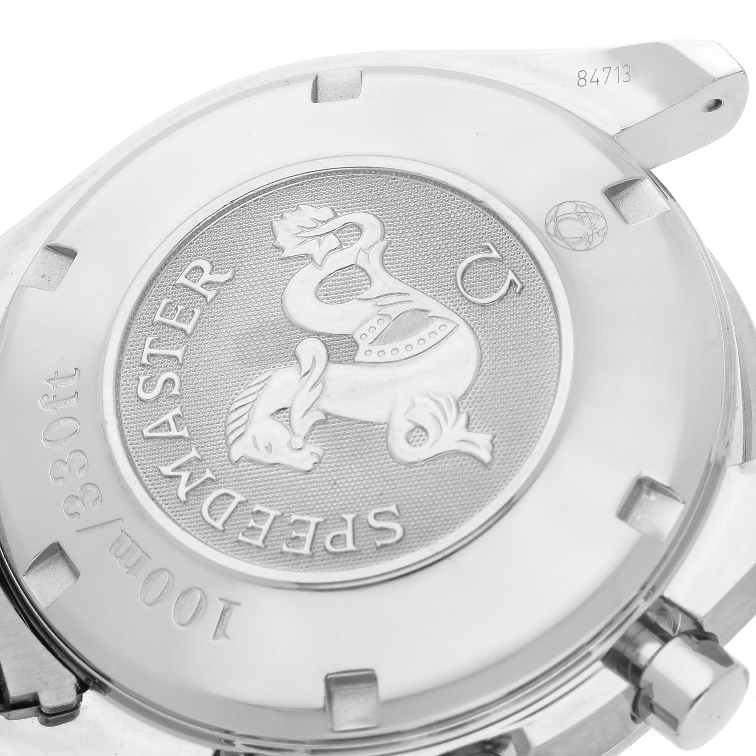 The image shows the case back of an Omega Speedmaster 3210.50.00 Men
s Stainless Steel Black Dial 3210.50.00 Men
s Stainless Steel Black Dial watch, highlighting the engraved logo and specifications.