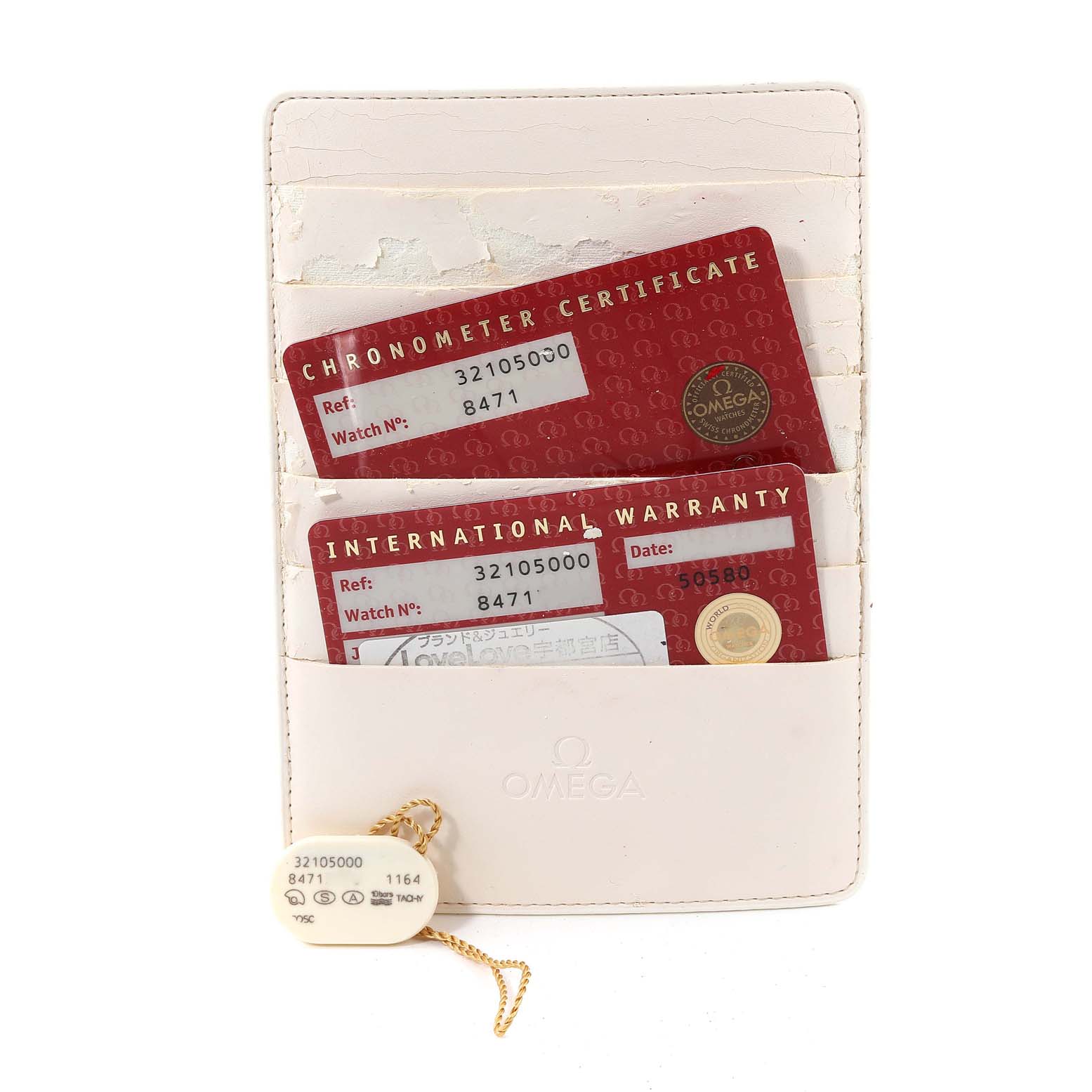 The image shows the Omega Speedmaster 3210.50.00 Men
s Stainless Steel Black Dial 3210.50.00 Men
s Stainless Steel Black Dial
s Chronometer Certificate, International Warranty card, and a tag in a holder.