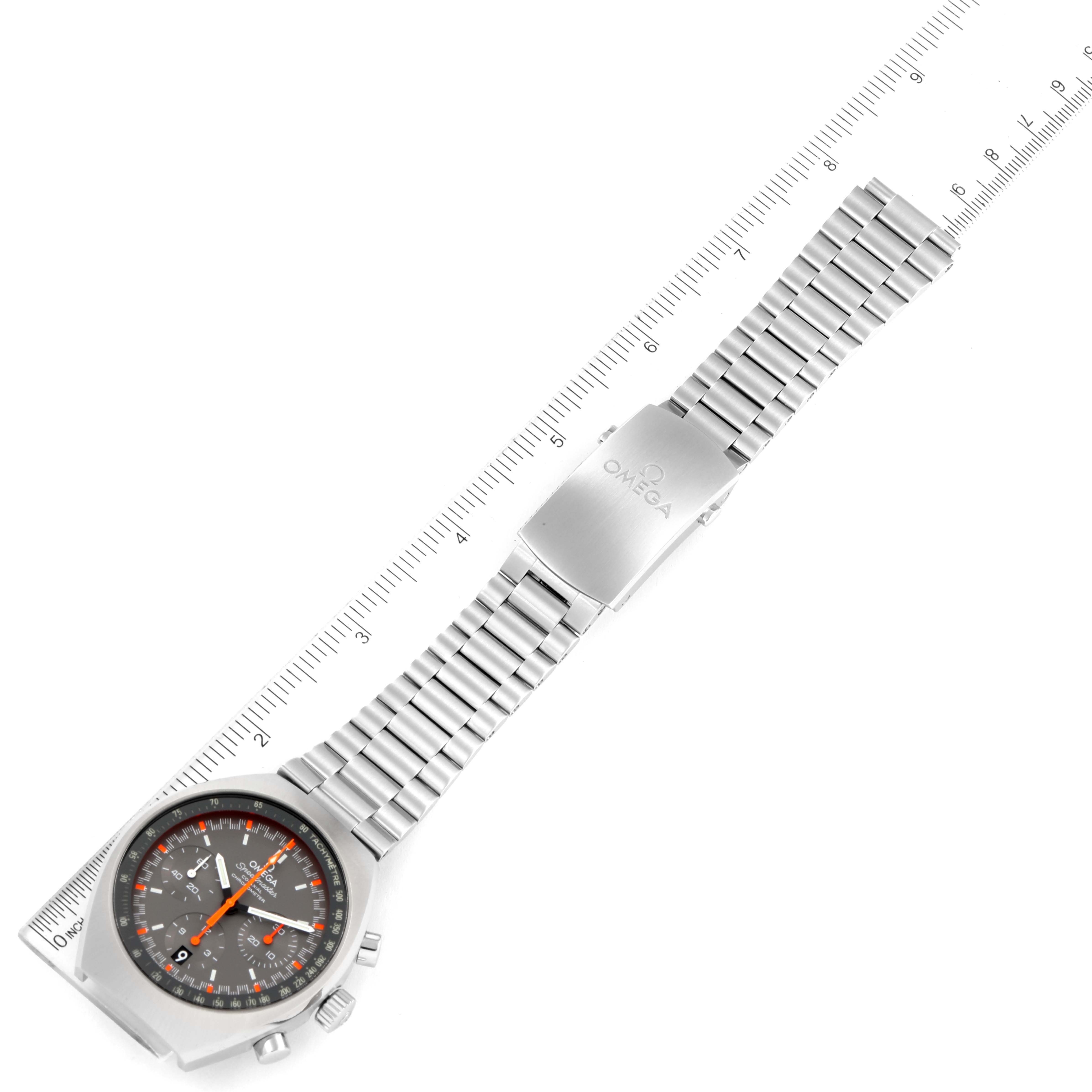 The image shows an Omega Speedmaster 327.10.43.50.06.001 Men's Stainless Steel Grey Dial 327.10.43.50.06.001 Men's Stainless Steel Grey Dial watch laid flat, featuring the dial, bracelet, and clasp with a ruler for scale.