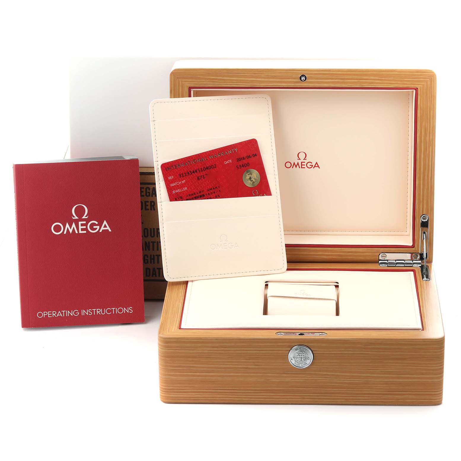 The image shows an Omega Speedmaster 311.93.44.51.04.002 Men's Ceramic White Dial 311.93.44.51.04.002 Men's Ceramic White Dial watch box, warranty card, and operating instructions at a frontal angle.