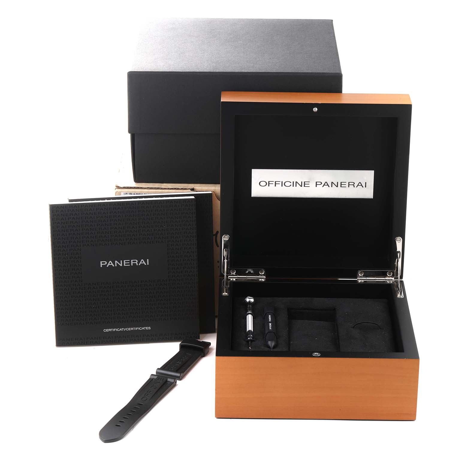 The image shows an open Panerai Luminor PAM01359 Men
s Stainless Steel Black Dial PAM01359 Men
s Stainless Steel Black Dial watch box with a booklet, tools, and an extra strap displayed.