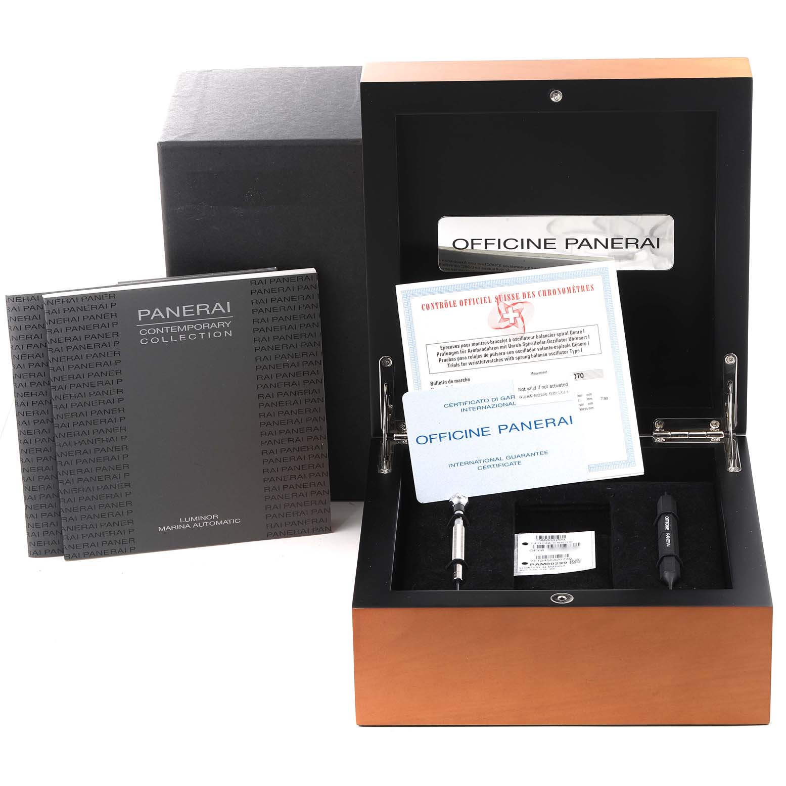 The image shows a Panerai Luminor PAM00299 Men
s Stainless Steel Black Dial PAM00299 Men
s Stainless Steel Black Dial watch box, certificates, tool, and user manual from a top-front angle.