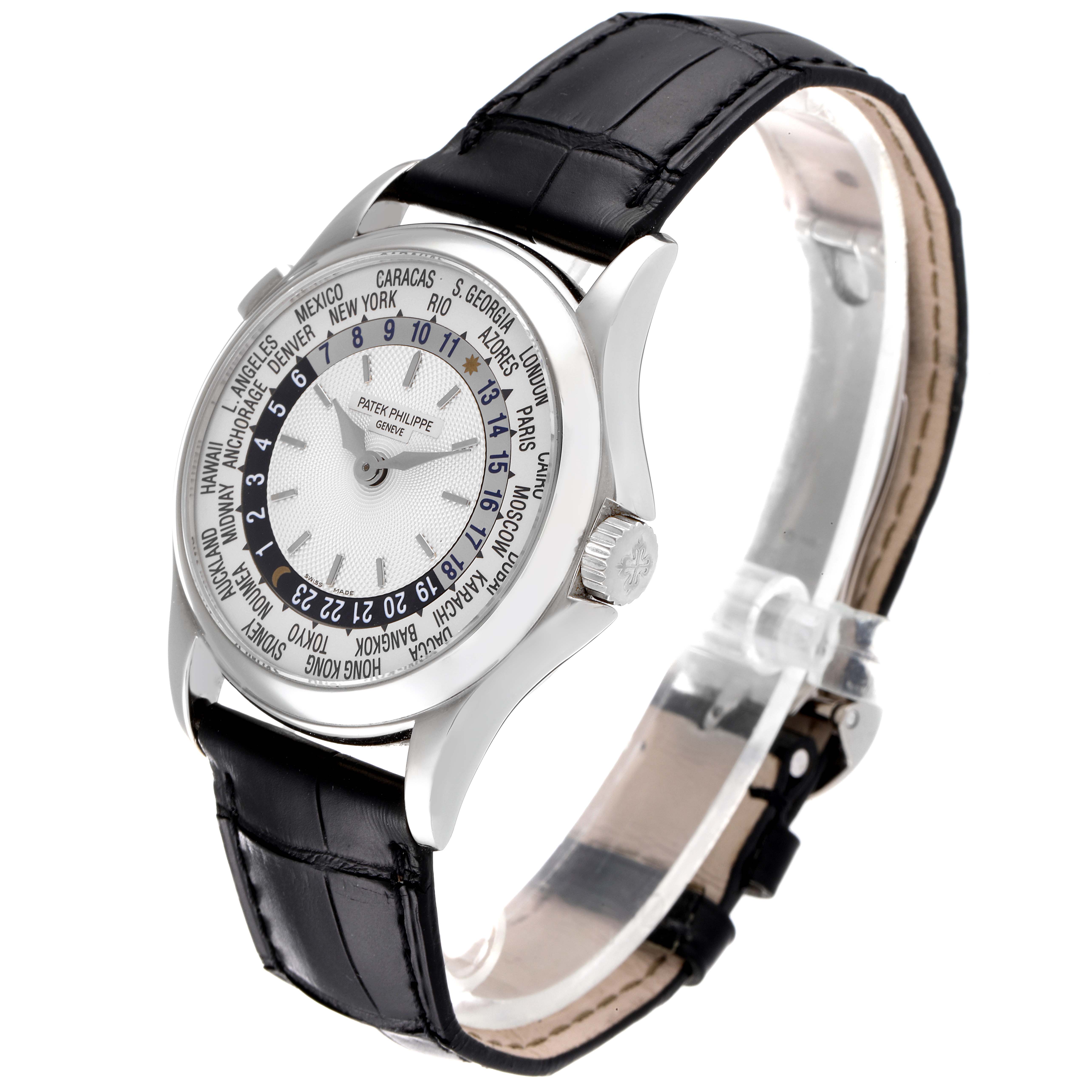 The image shows a Patek Philippe Calatrava 5110G Men's White Gold Silver Dial 5110G Men's White Gold Silver Dial watch angled from the front-left, highlighting its black leather strap and world time dial.