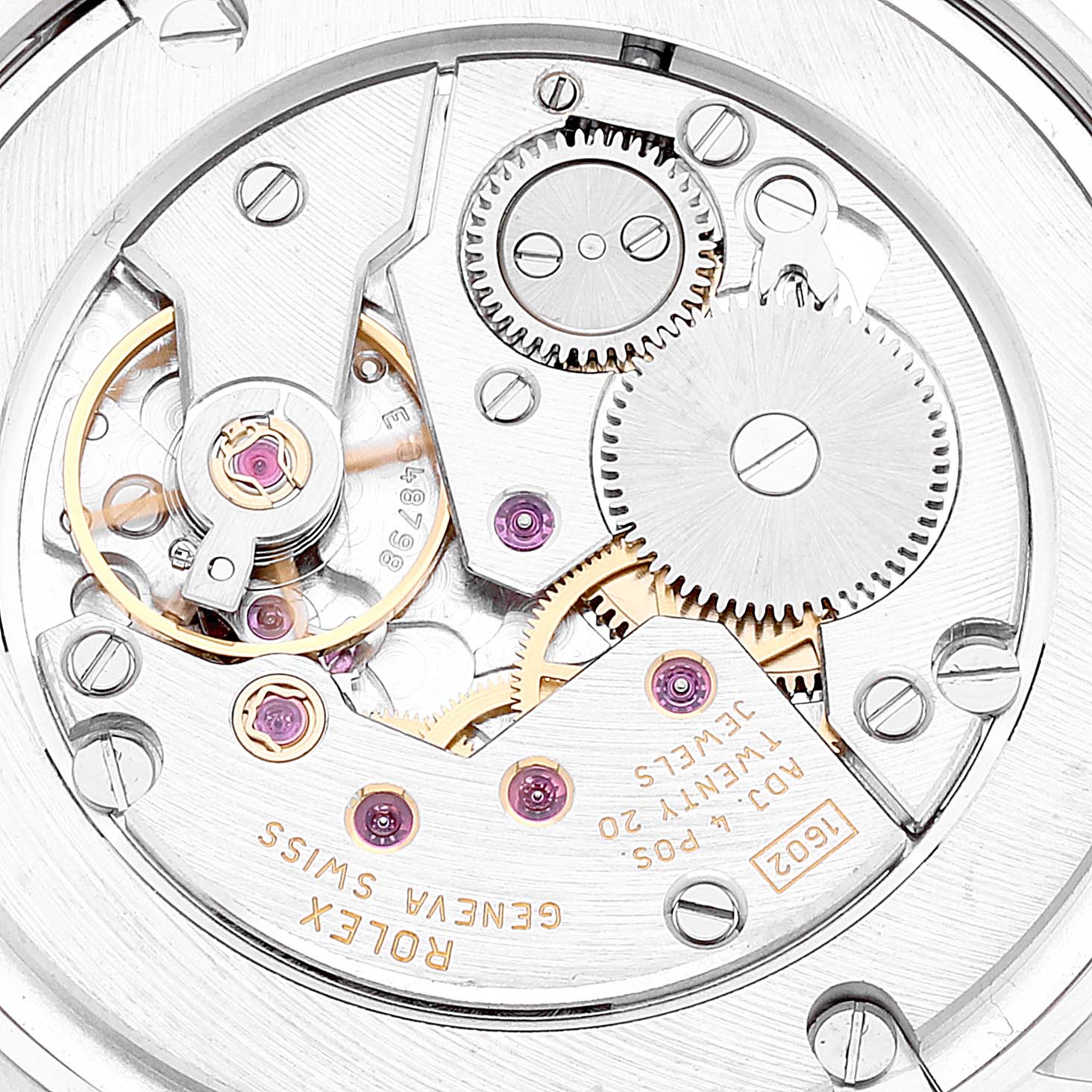 This image shows the internal mechanical movement of a Rolex Cellini 5116 Men's White Gold Beige Dial 5116 Men's White Gold Beige Dial watch, featuring gears and jewel bearings from a top-down angle.