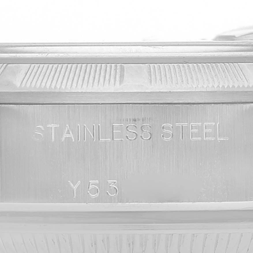 This close-up image shows the side detailing and engravings ("STAINLESS STEEL Y53") on the case of a Rolex Date 79190 Women
s Stainless Steel Black Dial 79190 Women
s Stainless Steel Black Dial model.