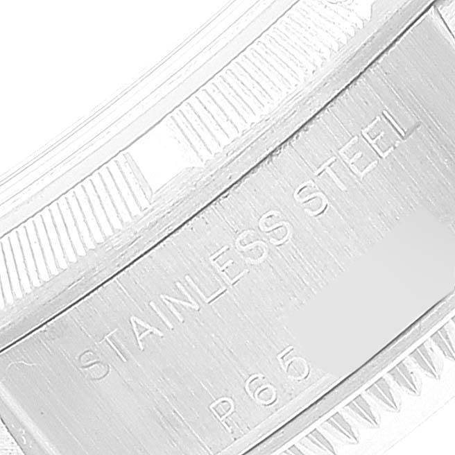 The image shows a close-up of the case back and bezel of a Rolex Date 79190 Women's Stainless Steel Silver Dial 79190 Women's Stainless Steel Silver Dial model watch engraved with "STAINLESS STEEL P65."