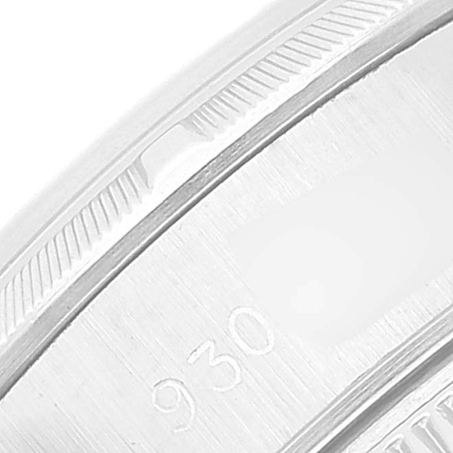 This image shows a close-up of the bezel and part of the case back of a Rolex Date 69190 Women's Stainless Steel White Dial 69190 Women's Stainless Steel White Dial model watch.