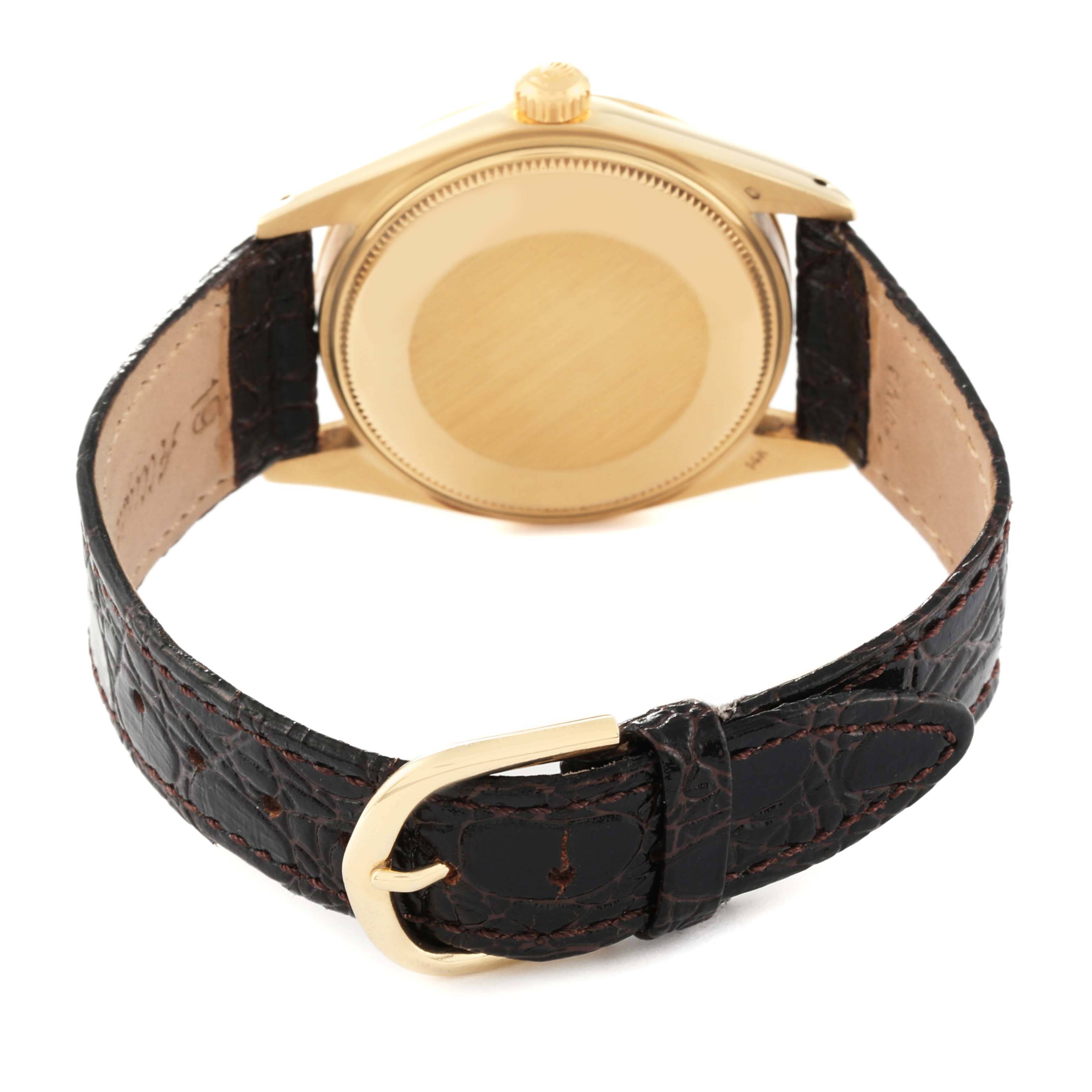 The image shows the back and strap of the Vintage Collection Rolex watch, featuring a gold case and a black leather strap.