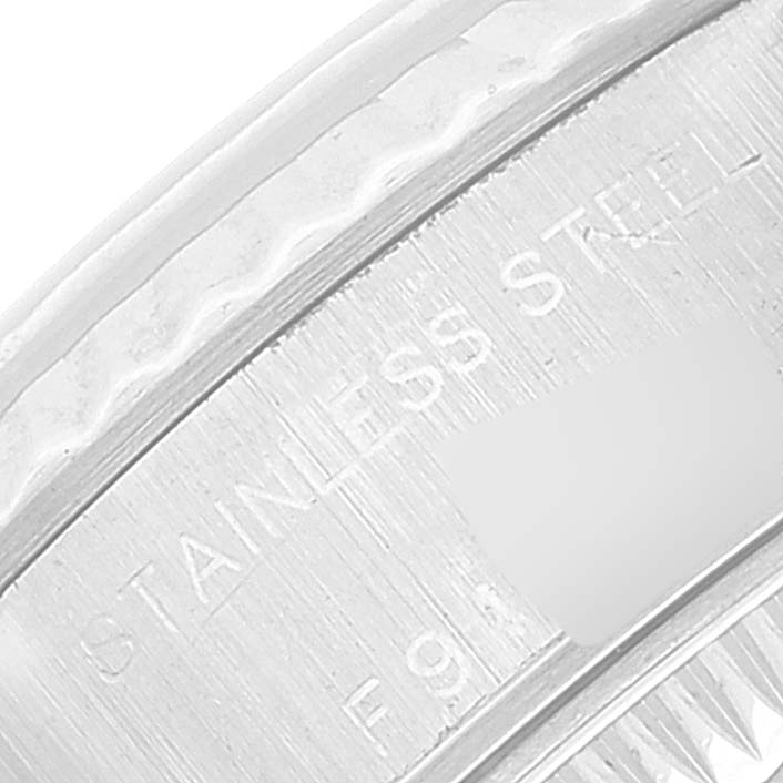 This close-up image shows the engraving on the stainless steel bezel of a Rolex Datejust 79174 Women's Stainless Steel Black Dial 79174 Women's Stainless Steel Black Dial watch.