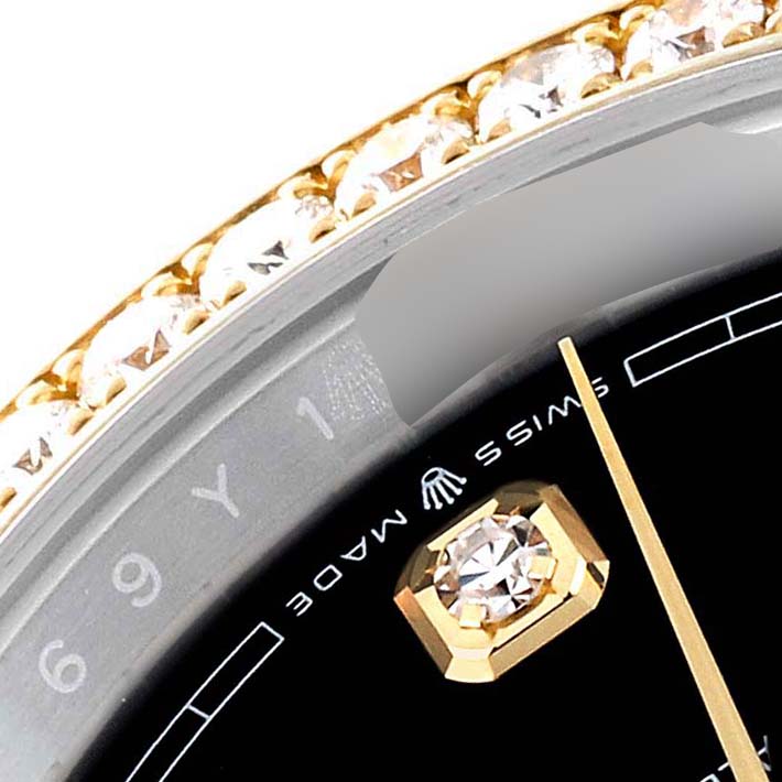The image shows a close-up of the Rolex Datejust 126283RBR Men's Steel and Gold (two tone) Black Dial 126283RBR Men's Steel and Gold (two tone) Black Dial watch's dial, with a diamond marker, part of the bezel, and the "Swiss Made" text.