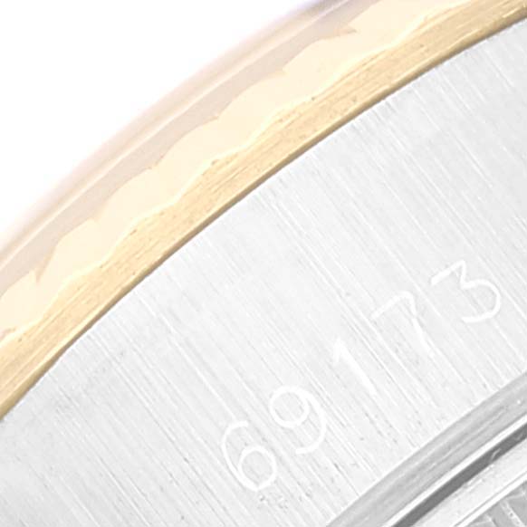 The image shows a close-up of the case side, including part of the bezel, with the serial number of the Rolex Datejust 69173 Women's Steel and Gold (two tone) Champagne Dial 69173 Women's Steel and Gold (two tone) Champagne Dial watch.