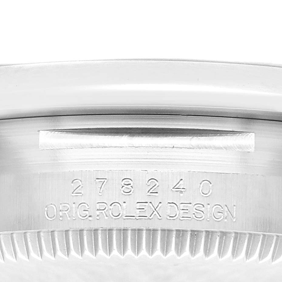 The image shows the side view of a Rolex Mid-Size 278240 Women's Stainless Steel Pink Dial 278240 Women's Stainless Steel Pink Dial model, highlighting the watch's serial number and engraving on the case.