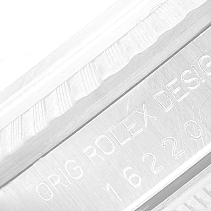 The image shows a close-up of the engraved inner bezel and model number on a Rolex Datejust 16220 Men's Stainless Steel Silver Dial 16220 Men's Stainless Steel Silver Dial watch.