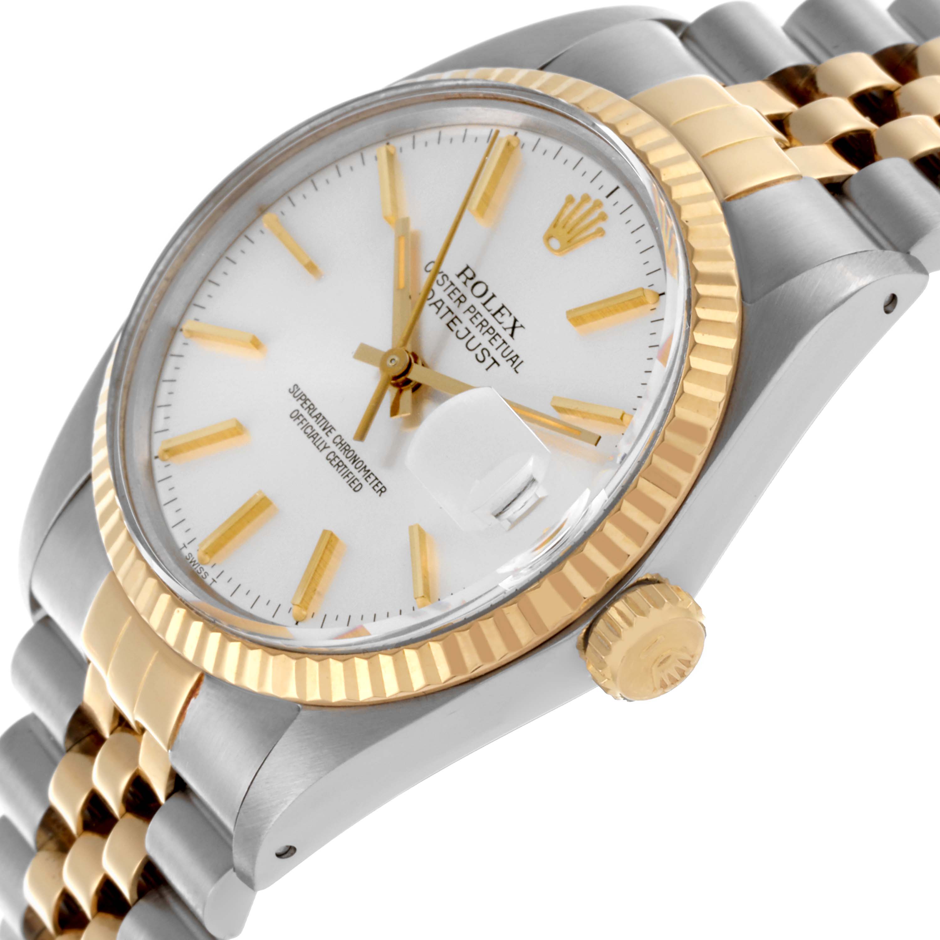 The Rolex Datejust 16013 Men's Steel and Gold (two tone) Silver Dial 16013 Men's Steel and Gold (two tone) Silver Dial watch is shown at an angled view featuring the bezel, dial, and bracelet.